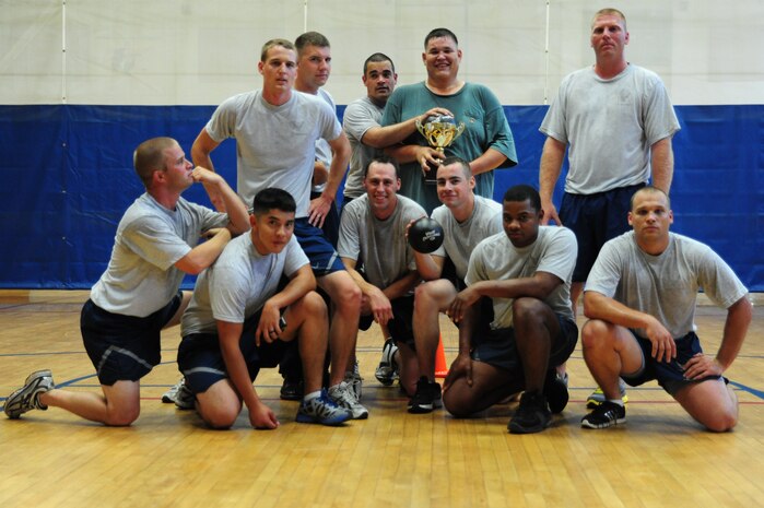 The 628th Civil Engineer Squadron's team poses for a photo after winning a dodge ball tournament, June 1, 2012 at the Joint Base Charleston - Air Base Fitness Center, S.C. In the past 10 years, it is estimated more than 66,000 Airmen have participated in the Fitness/Sports Challenge. (U.S. Air Force photo/ Airman 1st Class Chacarra Walker)