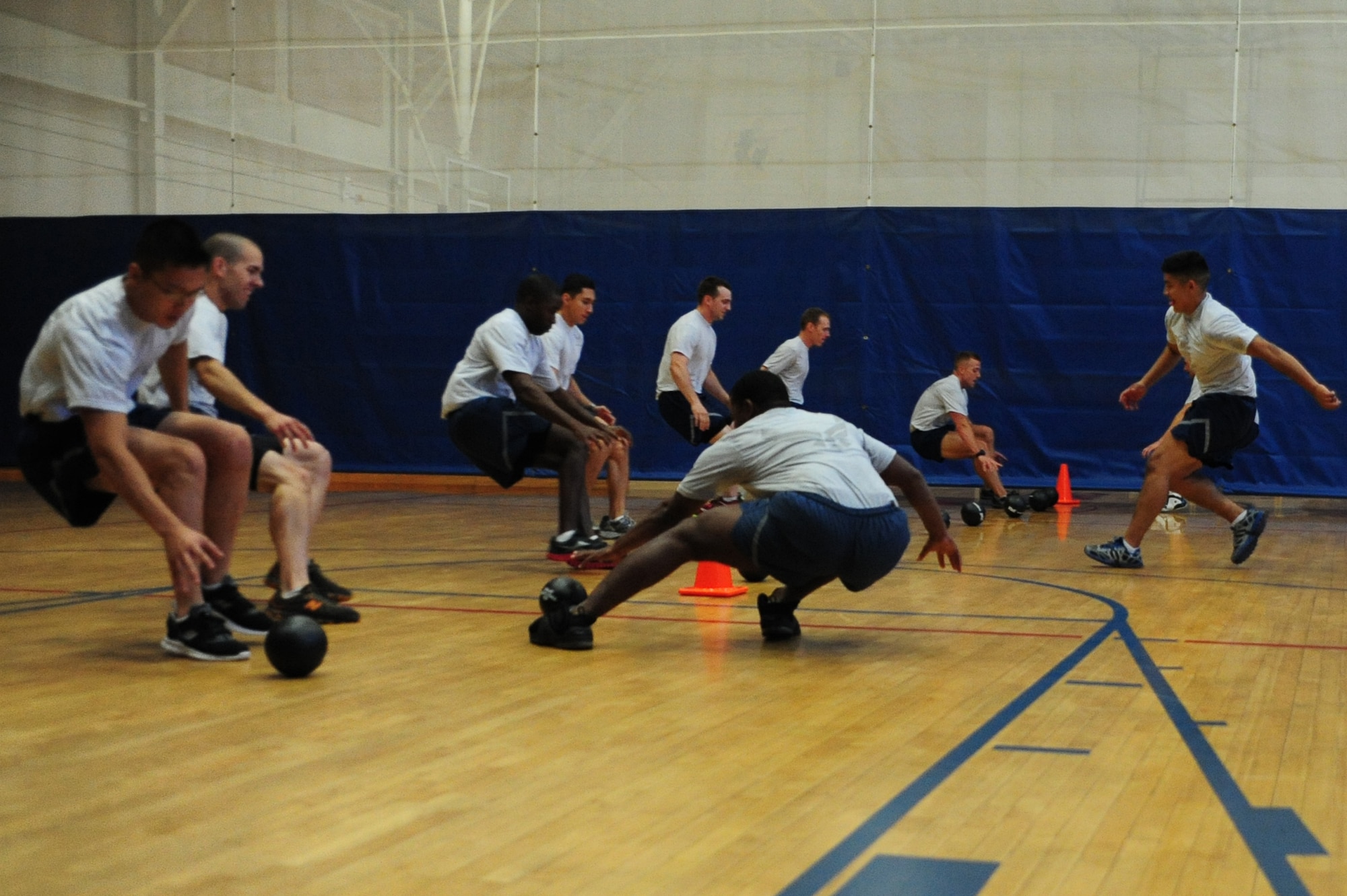 Airmen compete in a dodge ball game, June 1, 2012 at the Joint Base Charleston - Air Base Fitness Center, S.C. In the past 10 years, it is estimated more than 66,000 Airmen have participated in the Fitness/Sports Challenge. (U.S. Air Force photo/ Airman 1st Class Chacarra Walker)