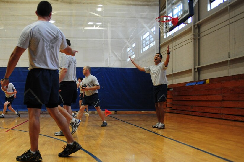 Airmen compete in a dodge ball game, June 1, 2012 at the Joint Base Charleston - Air Base Fitness Center. In the past 10 years, it is estimated more than 66,000 Airmen have participated in the Fitness/Sports Challenge. (U.S. Air Force photo/ Airman 1st Class Chacarra Walker)