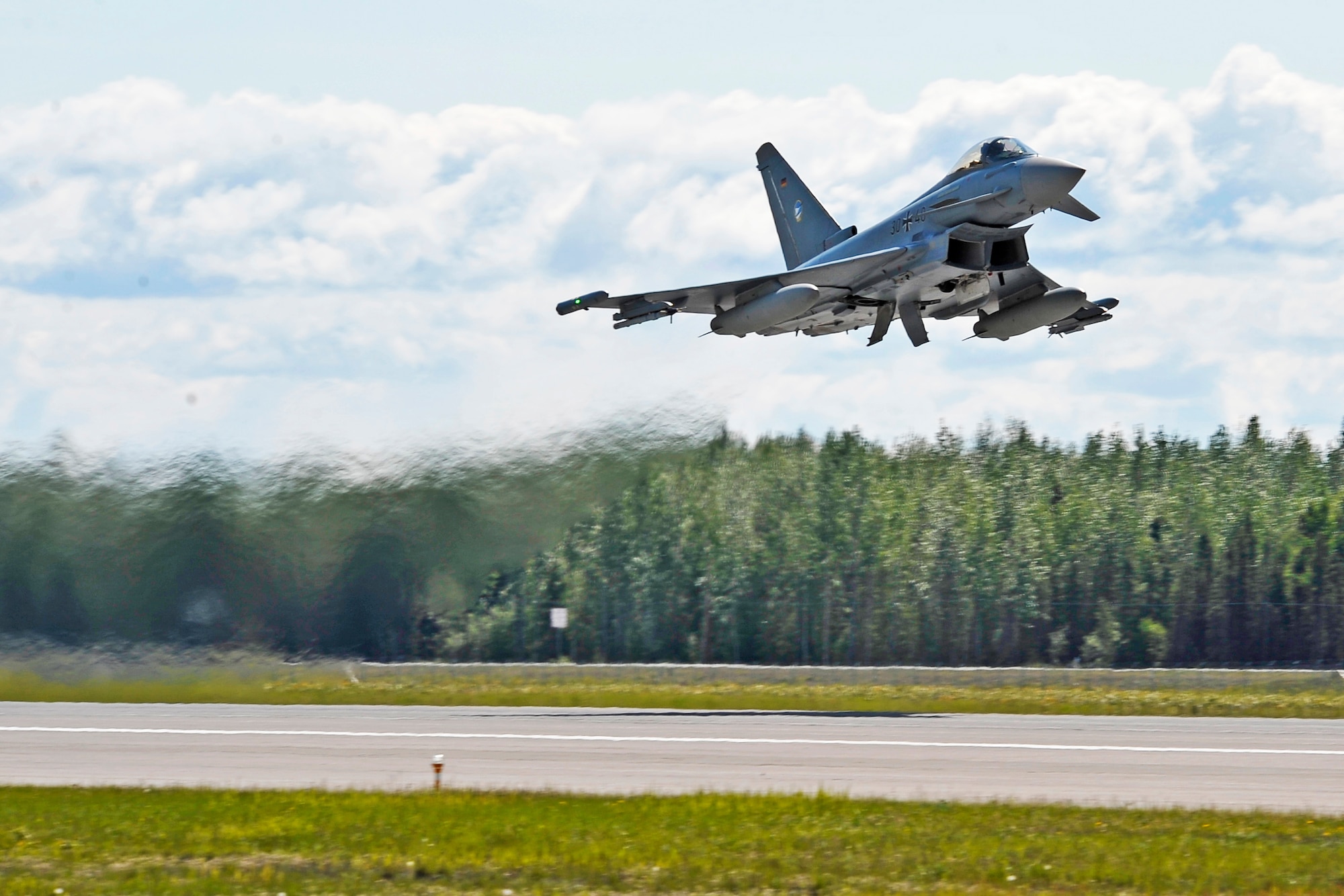 A German air force Eurofighter Typhoon launches from the runway June 4, 2012, Eielson Air Force Base, Alaska.  The GAF is participating in RED FLAG-Alaska 12-2, a two-week-long exercise providing aircrew realistic combat sorties and increasing their chances of survival in combat.  (U.S. Air Force photo/Staff Sgt. Miguel Lara III)