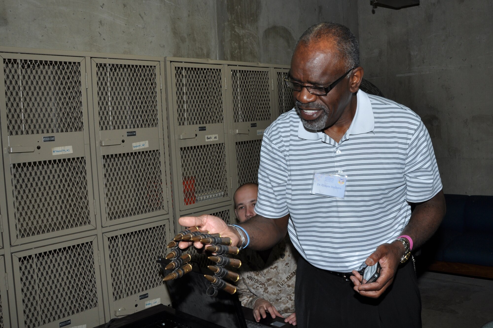 YOUNGSTOWN AIR RESERVE STATION, Ohio – Dr. Connie Hathorn, Youngstown City Schools superintendent, observes ammunition at the weapons training simulator at the Naval-Marine Center as part of a civic leader tour June 22, 2012. The civic leader tour program is part of the 910th Airlift Wing’s community relations initiative and is made possible by funding from the Base Community Council.  (U.S. Air Force photo by Staff Sgt. Megan Tomkins)