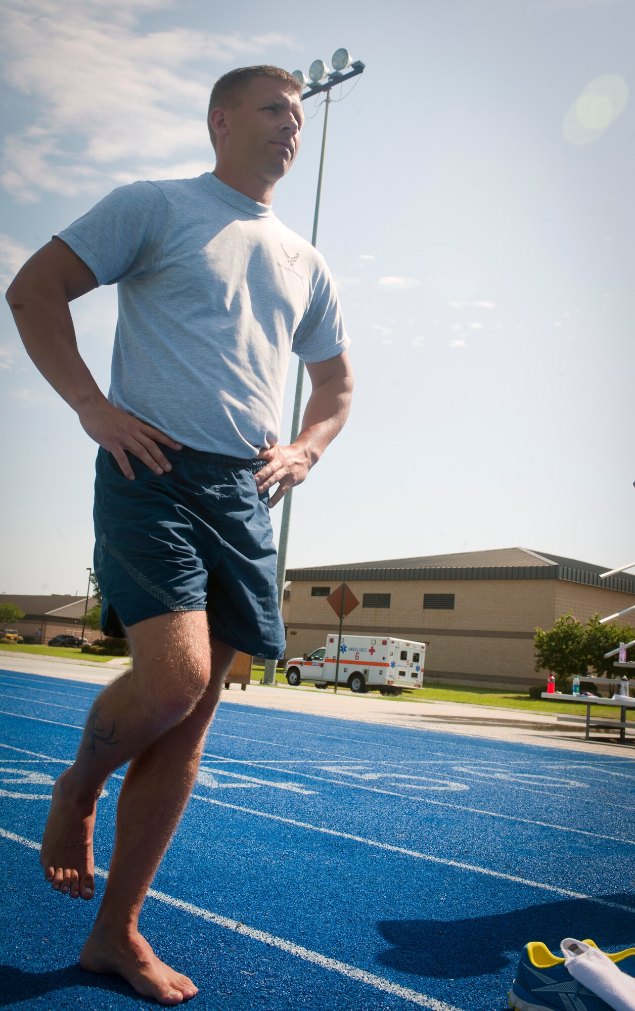 U.S. Air Force Staff Sgt. Joshua Pipp, 822nd Base Defense Squadron fire team leader, balances on one foot as part of a running clinic at Moody Air Force Base, Ga., May 30, 2012. The technique was used to gauge runners’ leg strength and balance.  (U.S. Air Force photo by Airman 1st Class Jarrod Grammel/Released)
