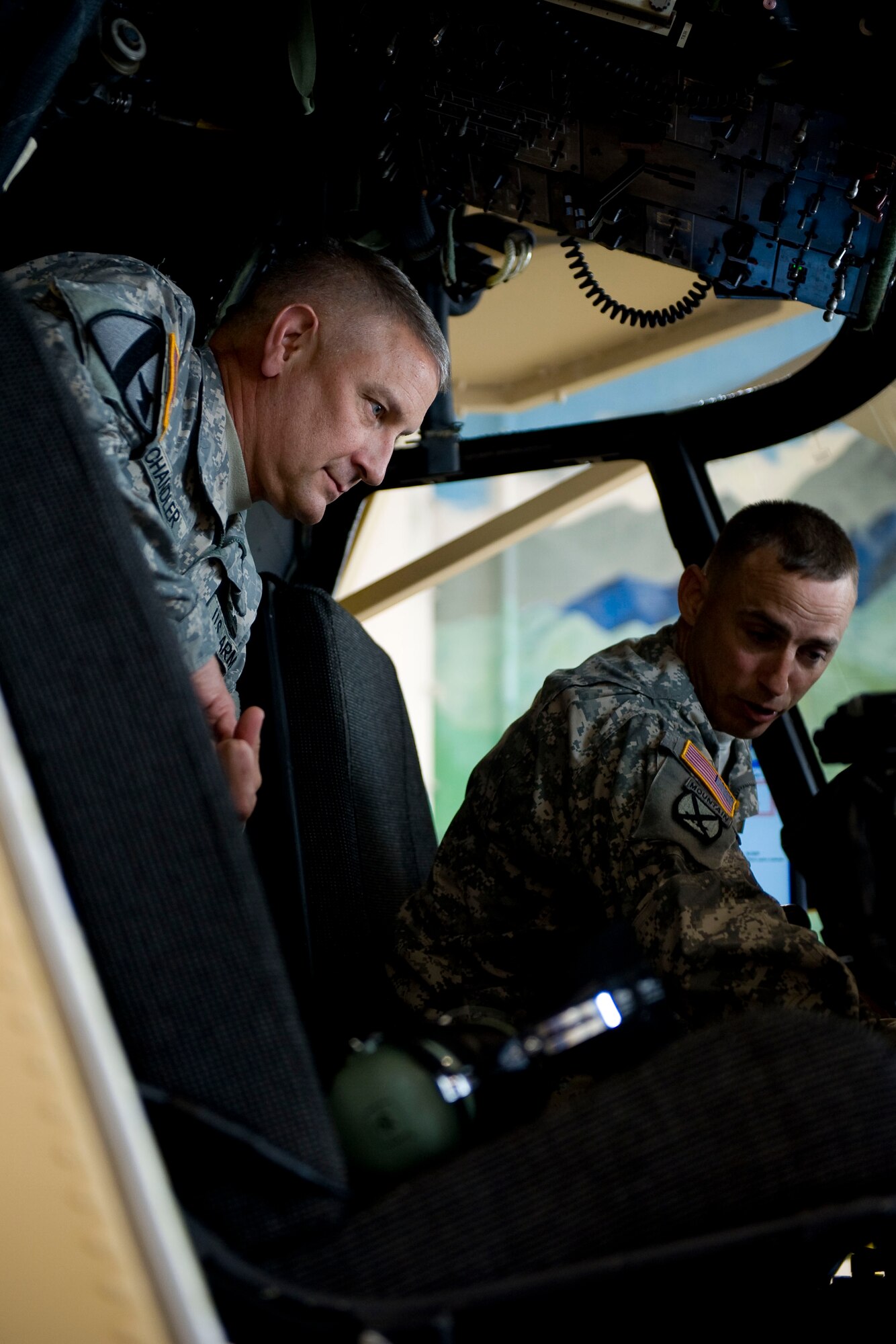 Sergeant Maj. of the Army Raymond F. Chandler III, left. is briefed about the CH-47 Chinook maintenance trainer by Staff Sgt. Garry May, Alpha Company, 2-210th Aviation Regiment, 128th Avn. Brigade, at the 128th Avn. Bde. training facility at Ft. Eustis, Va., June 5, 2012. While at the 128th Avn. Bde., Chandler learned how Soldiers and Airmen train in helicopter repair courses. (U.S. Air Force photo by Senior Airman John D. Strong II/Released)

