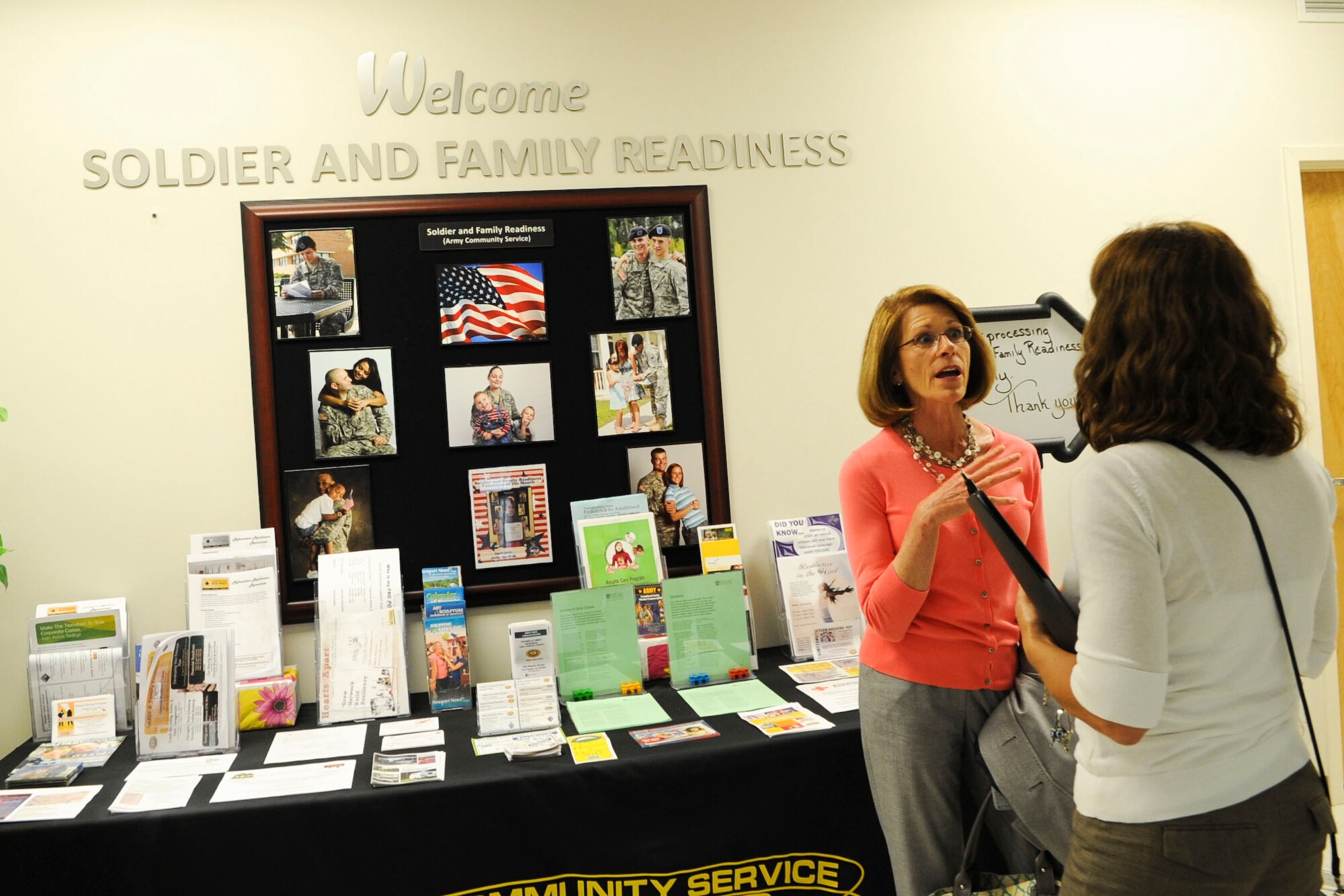 Donna Fontes, far right, Soldier and Family Assistance programs chief, gives Jeanne Chandler, wife of Sgt. Maj. of the Army Raymond F. Chandler III, a tour of the Soldier and Family Readiness building at Ft. Eustis, Va., June 5, 2012. During their visit to Eustis, Chandler and his wife visited Soldiers from units across post and visited various Soldier support organizations. (U.S. Air Force photo by Senior Airman Wesley Farnsworth/Released)