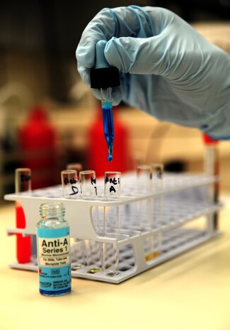 Petty Officer 3rd Class Jesus Pena, a hospital corpsman with the Naval Health Clinic at Joint Base Charleston – Weapons Station, S.C., drips a single drop of activation agent into a test tube in preparation of blood clot testing June 1, 2012. All donated blood is thoroughly tested at the clinic to ensure the donated blood is able to be used in the future. (U.S. Air Force photo / Senior Airman Dennis Sloan)