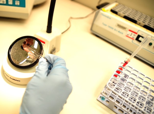 Petty Officer 3rd Class Jesus Pena, a hospital corpsman with the Naval Health Clinic at Joint Base Charleston – Weapons Station, S.C., checks to see if the activating blood agent causes clotting to a test specimen June 1, 2012. All donated blood is thoroughly checked at the clinic to ensure the donated blood is able to be used in the future. (U.S. Air Force photo / Airman 1st Class Tom Brading