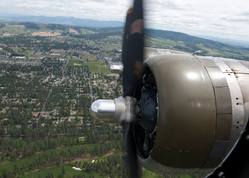 Experimental Aircraft Association B-17 Aluminum Overcast flies over Spokane Valley, Wash., May 29, 2012. Members of Team Fairchild had the unique opportunity to tour the B-17 from June 1 to 3, 2012. Tens of thousands have had the opportunity to experience the B-17 "Flying Fortress" since it has been fully restored and started touring the United States in 1994. (U.S. Air Force photo by Staff Sgt. Michael Means/Released)  