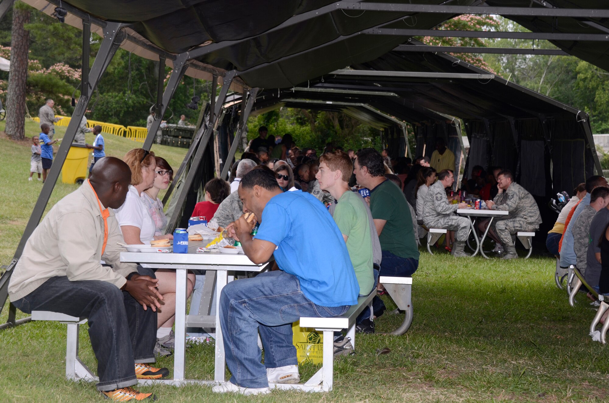 Reservists, families and friends take time to enjoy a picnic lunch at the 94th Airlift Wing Annual Family Day June 3. (U.S. Air Force photo/Don Peek)