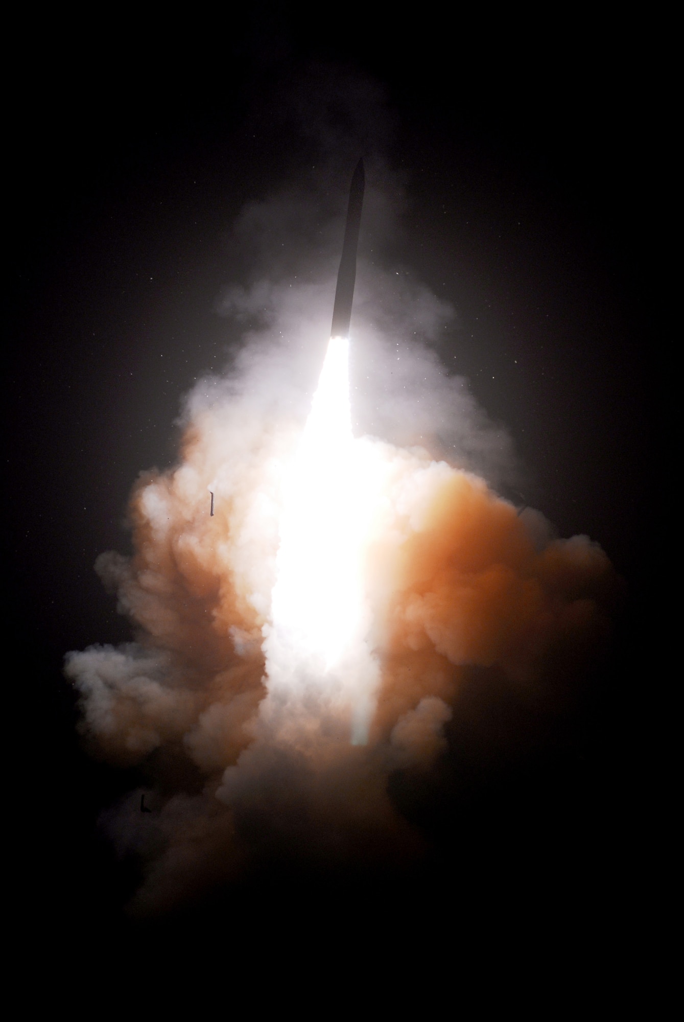 A Minuteman III intercontinental ballistic missile configured with a National Nuclear Security Administration joint test assembly launches May 22, 2008, from Vandenberg Air Force Base, Calif. The 50th Space Communications Squadron recently completed upgrades to ballistic missile warning sensors communications systems around the world. (U.S. Air Force photo)