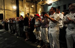 The crowd on board the USS Yorktown (CV-10) applauds John Hancock June 4, 2012, after he delivered his story describing his actions during the Battle of Midway. Hancock watched several of his friends die during the battle. He suffered a neck wound and a collapsed lung during the battle. He abandoned ship and waited to be rescued for hours. (U.S. Air Force photo/Senior Airman Dennis Sloan)
