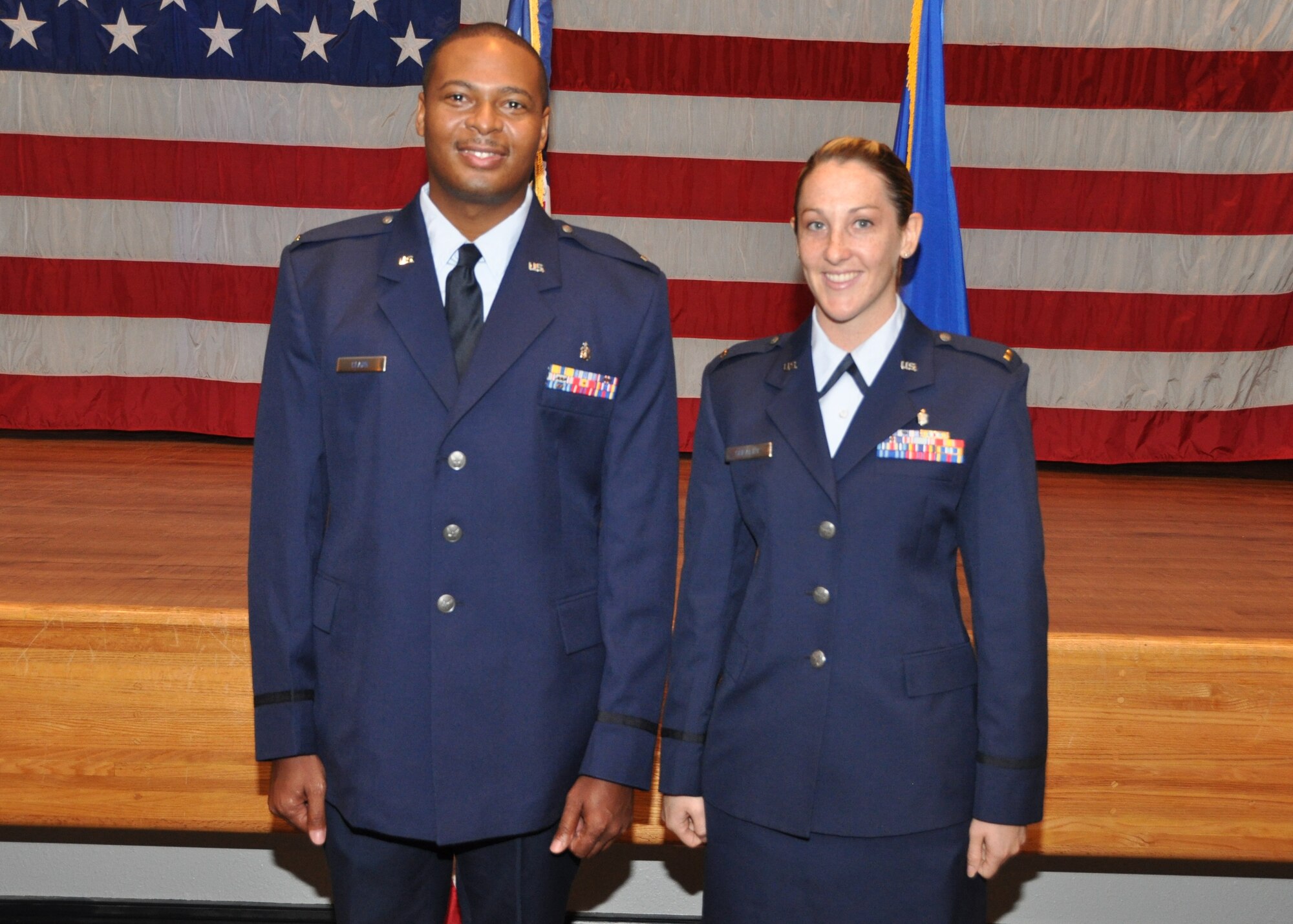 Second Lts. Donelle Clark, a former technical sergeant and member of the 81st Surgical Operations Squadron, and Jessica Shealey, a former staff sergeant with the 81st Dental Squadron, pose after graduation where they were commissioned as second lieutenants during a ceremony May 8, 2012, in the Keesler Hospital’s Don Wylie Auditorium at Keesler Air Force Base, Miss. (U.S. Air Force photo by Steve Pivnick)