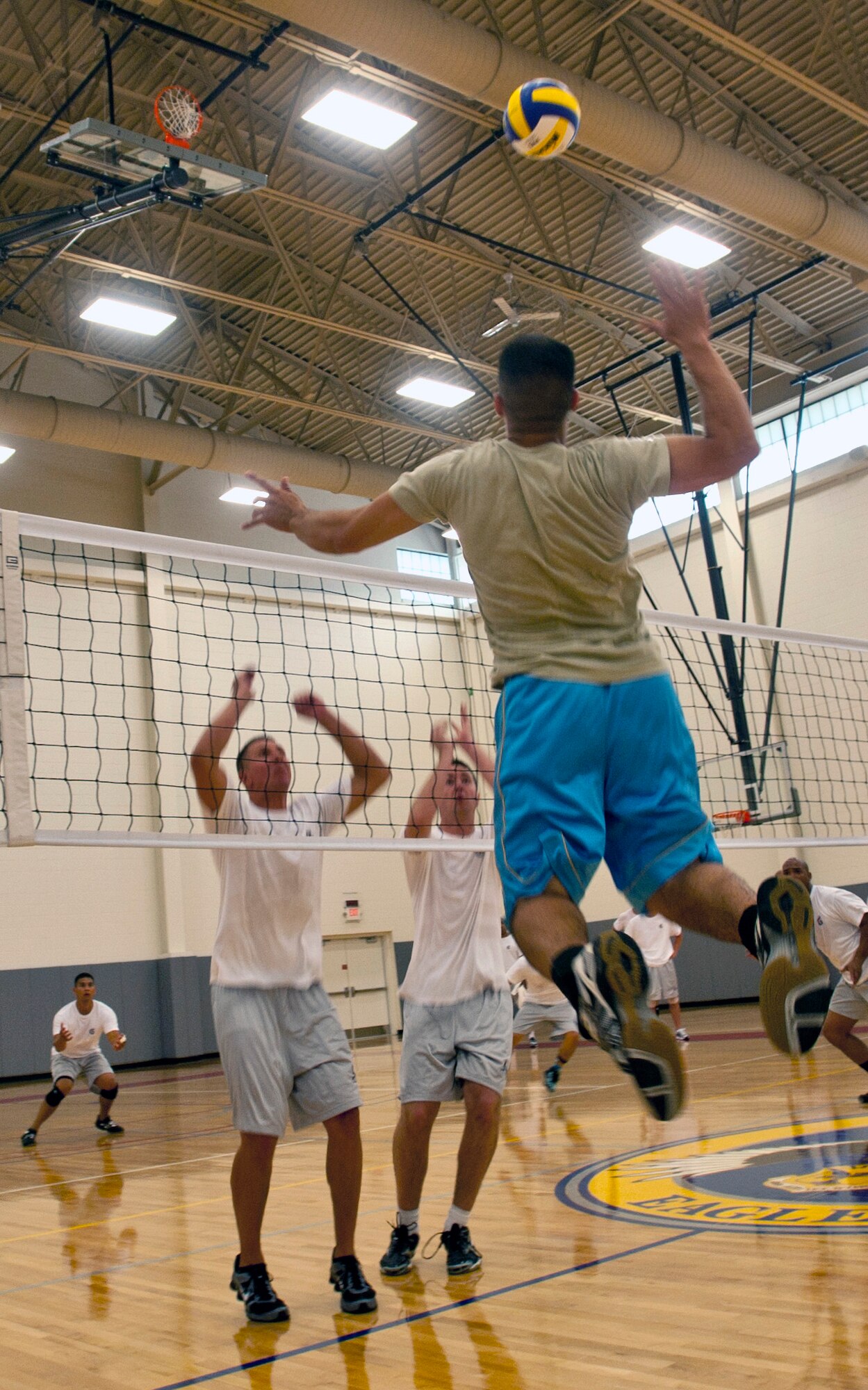 A scrimmage between prospective members of the All-Air Force Men’s Volleyball Team and Team Dover takes place June 4, 2012, at the Fitness Center on Dover Air Force Base, Del. Dover AFB is hosting the team as it undergoes a three-week training camp in preparation for the 2012 Armed Forces Indoor Volleyball Championship. (U.S. Air Force photo by Senior Airman Jacob Morgan)