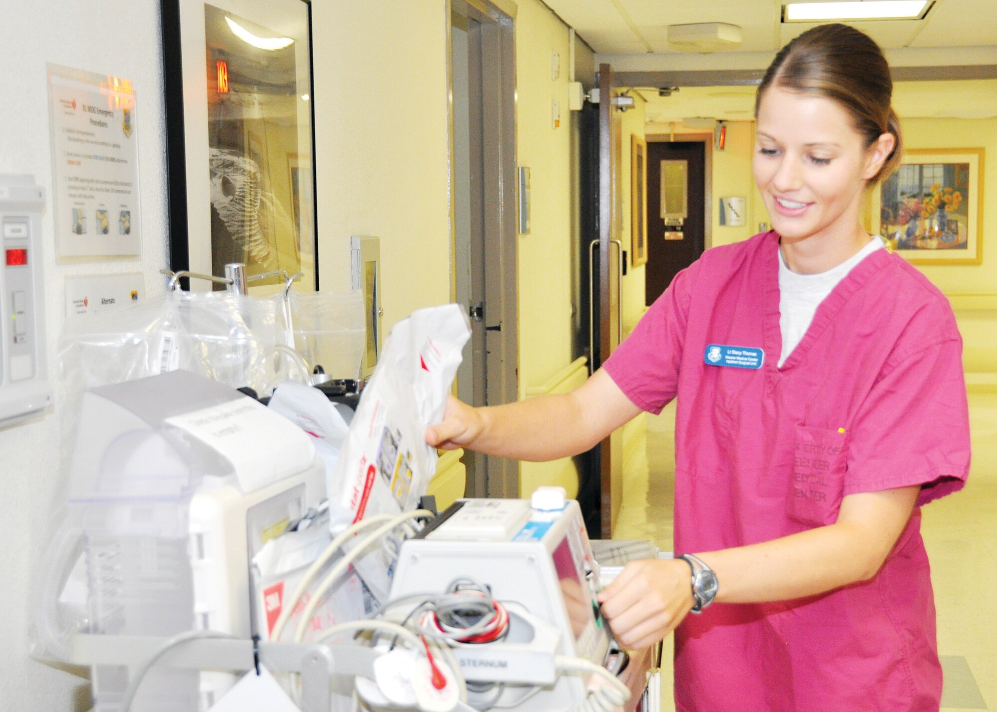 Second Lt. Stacy Thomas, 81st Inpatient Operations Squadron, surgical inpatient unit clinical nurse, checks the equipment on a medical inpatient unit crash cart May 29, 2012, at the Keesler Hospital, Keesler Air Force Base, Miss. Thomas recently helped thwart a would-be purse snatcher at William Carey University when she noticed an elderly woman hitting a man in the parking lot.  (U.S. Air Force photo by Steve Pivnick)