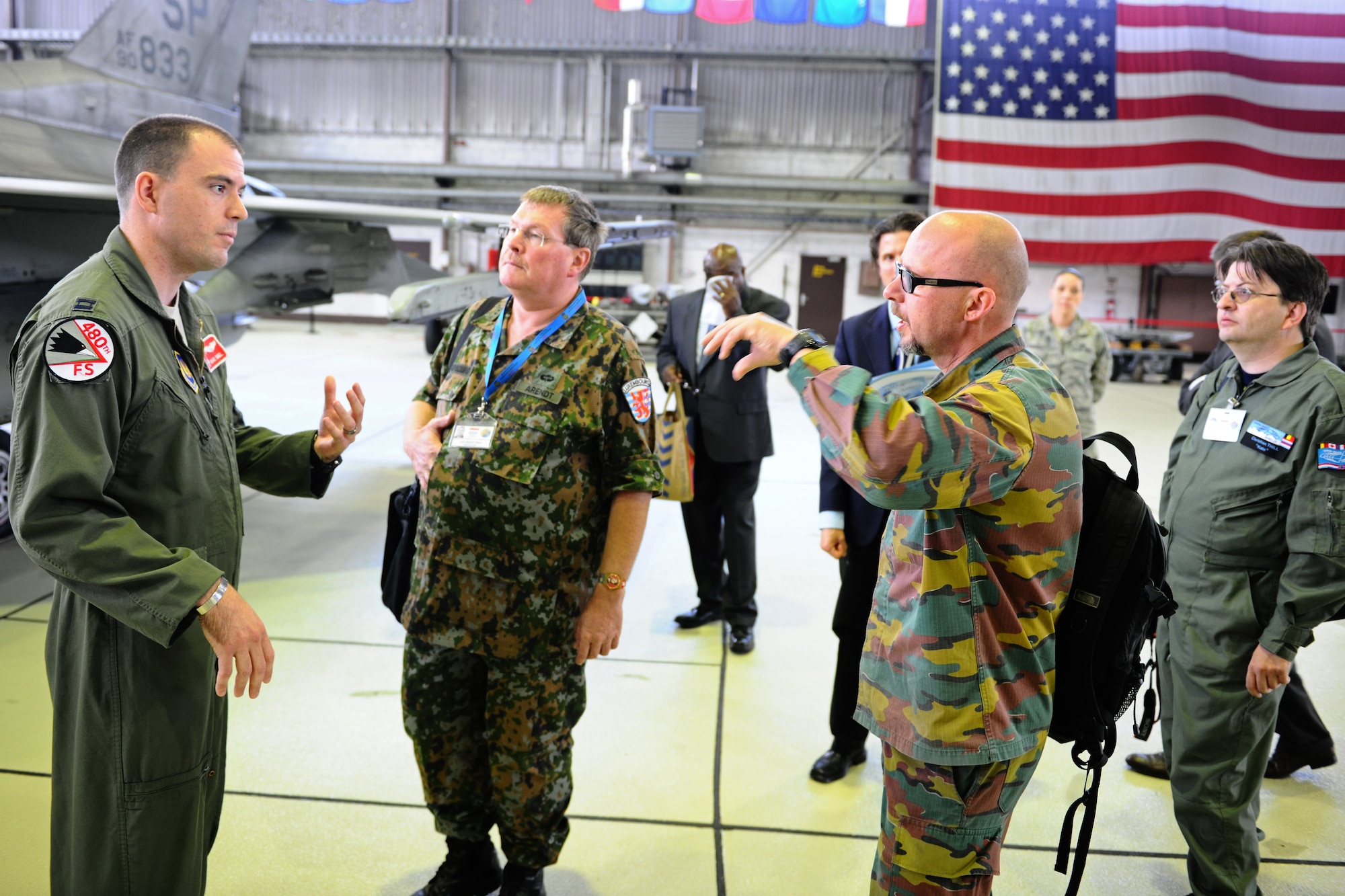 SPANGDAHLEM AIR BASE, Germany – Capt. David Dubel, 480th Fighter Squadron assistant chief of weapons, speaks with Vienna Document 11 evaluation team members from Luxembourg and Belgium about the capabilities of the F-16 Fighting Falcon at Hangar 1 here during an exercise of the Vienna Document 11 Evaluation here June 5. The exercise was conducted to ensure the base is prepared for procedures used during an actual Vienna Document evaluation. (U.S. Air Force photo by Airman 1st Class Matthew B. Fredericks/Released)