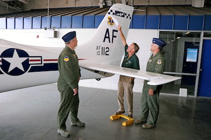 The 12th FTW tail flash is unveiled on a T-53A trainer during a redesignation ceremony at the U.S. Air Force Academy's airfield in Colorado Springs, Colo. June 6, 2012.   Led by 12th Flying Training Wing commander Col. RIchard Murphy and Col. Richard Plamp, commander 306th Flying Training Group, the 12th FTW took formal control of the group June 1 by order of Gen. Edward Rice, commander of Air Education and Training Command, due to the scheduled inactivation of the 19th Air Force.    (U.S. Air Force photo/Mike Kaplan) 