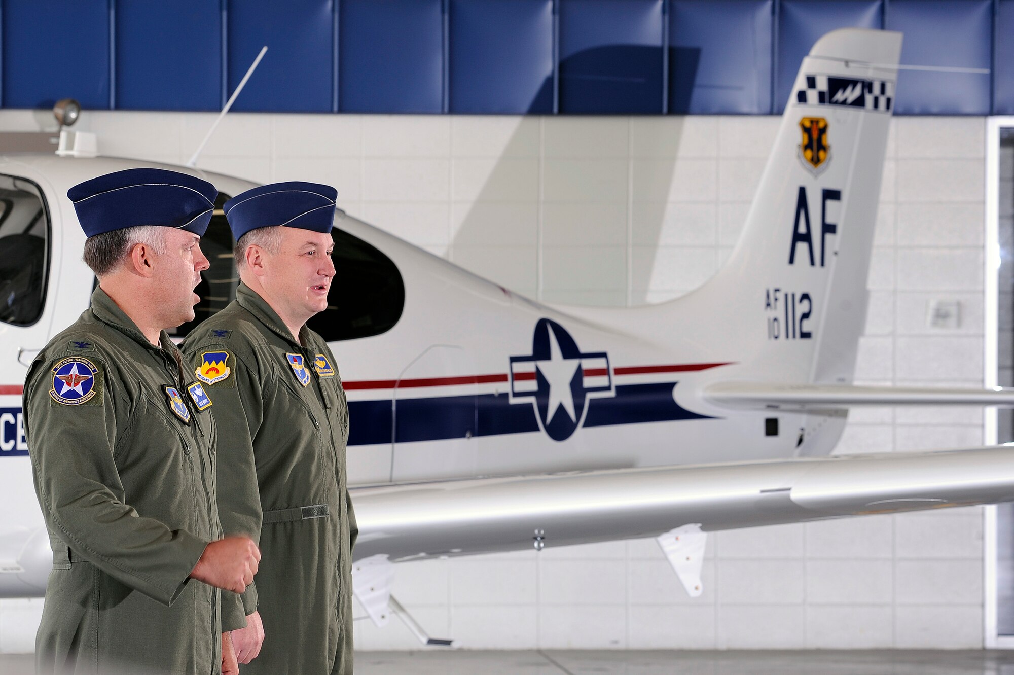 Col. Richard Murphy, commander 12th Flying Training Wing and Col. Richard Plamp, commander 306th Flying Training Group, U.S. Air Force Academy, Colo. close the 12th Redesignation Ceremony at the Academy's airfield in Colorado Springs, Colo. June 6, 2012.   The 12th FTW took formal control of the group June 1 by order of Gen. Edward Rice, commander of Air Education and Training Command, due to the scheduled inactivation of the 19th Air Force.    (U.S. Air Force photo/Mike Kaplan) 