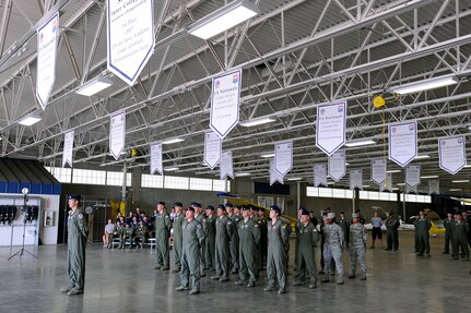Members of the 306th Flying Training Group participate in a redesignation ceremony at the  U.S. Air Force Academy's airfield in Colorado Springs, Colo. June 6, 2012.   Led by 12th Flying Training Wing commander Col. RIchard Murphy and Col. Richard Plamp, commander 306th Flying Training Group, the 12th FTW took formal control of the group June 1 by order of Gen. Edward Rice, commander of Air Education and Training Command, due to the scheduled inactivation of the 19th Air Force.    (U.S. Air Force photo/Mike Kaplan) 