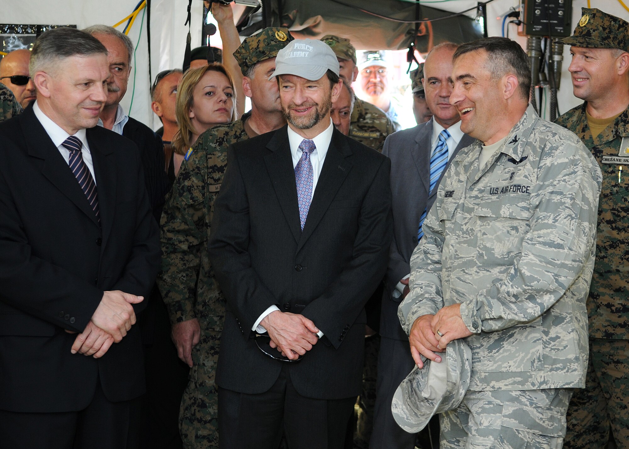 Col. Daniel Gerke, 48th Inpatient Operations Squadron commander, RAF Lakenheath, England, shows Patrick S. Moon, U.S. ambassador to Bosnia and Herzegovina, around the expeditionary medical facility here June 6, 2012. More than 500 military members from nine nations are participating in SR12, the annual U.S. Joint Chiefs of Staff sponsored exercise, May 28 - June 8. The goals of the exercise are to strengthen interoperability, facilitate training in crisis response and disaster management, and validate the readiness of deployable military medical and humanitarian assistance teams. The exercise, in the spirit of partnership for peace, directly supports U.S. European Command's theater cooperation efforts and strategy for active security with European countries.