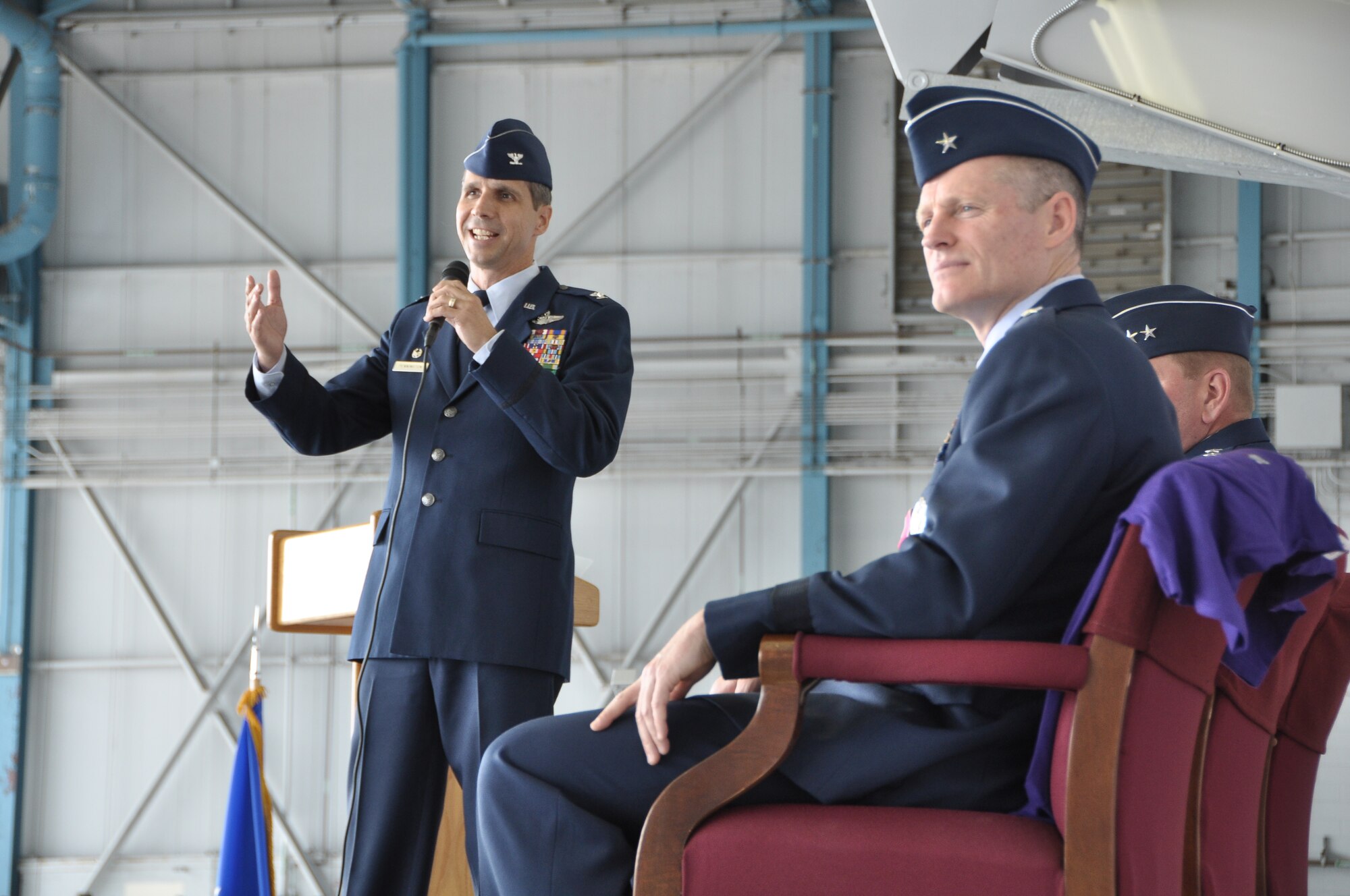Col. Jeffrey T. Pennington addresses the audience during the 433rd Airlift Wing Change of Command ceremony at the 433rd AW on Joint Base San Antonio – Lackland AFB, Texas, June 3, 2012. Col. Pennington assumed command from Brig. Gen. Kenneth D. Lewis, forefront (U.S. Air Force photo/Senior Airmen Brian McGloin)