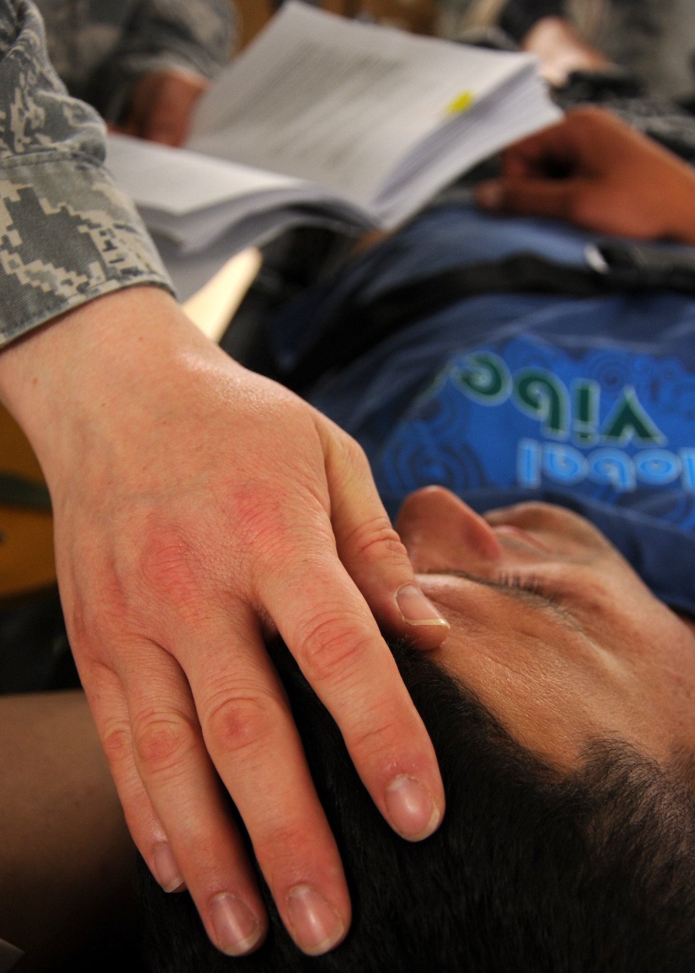 CAPLJINA, Bosnia and Herzegovina -- Chaplain (Capt.) Matt Glaros, 48th Fighter Wing, prays for a patient during Shared Resilience 2012, June 5. During the two-week exercise, Glaros and Tech. Sgt. Andrew Morgan, 48th FW chaplain assistant, organized church services and activities for service members. More than 500 military members from nine nations are participating in SR12, an annual U.S. Joint Chiefs of Staff-sponsored medical exercise, May 28 - June 8. The goals of the exercise are to strengthen interoperability, facilitate training in crisis response and disaster management, and validate the readiness of deployable military medical and humanitarian assistance teams. The exercise, in the spirit of partnership for peace, directly supports U.S. European Command's theater cooperation efforts and strategy for active security with European countries. (U.S. Air Force photo by Staff Sgt. Daryl Knee)