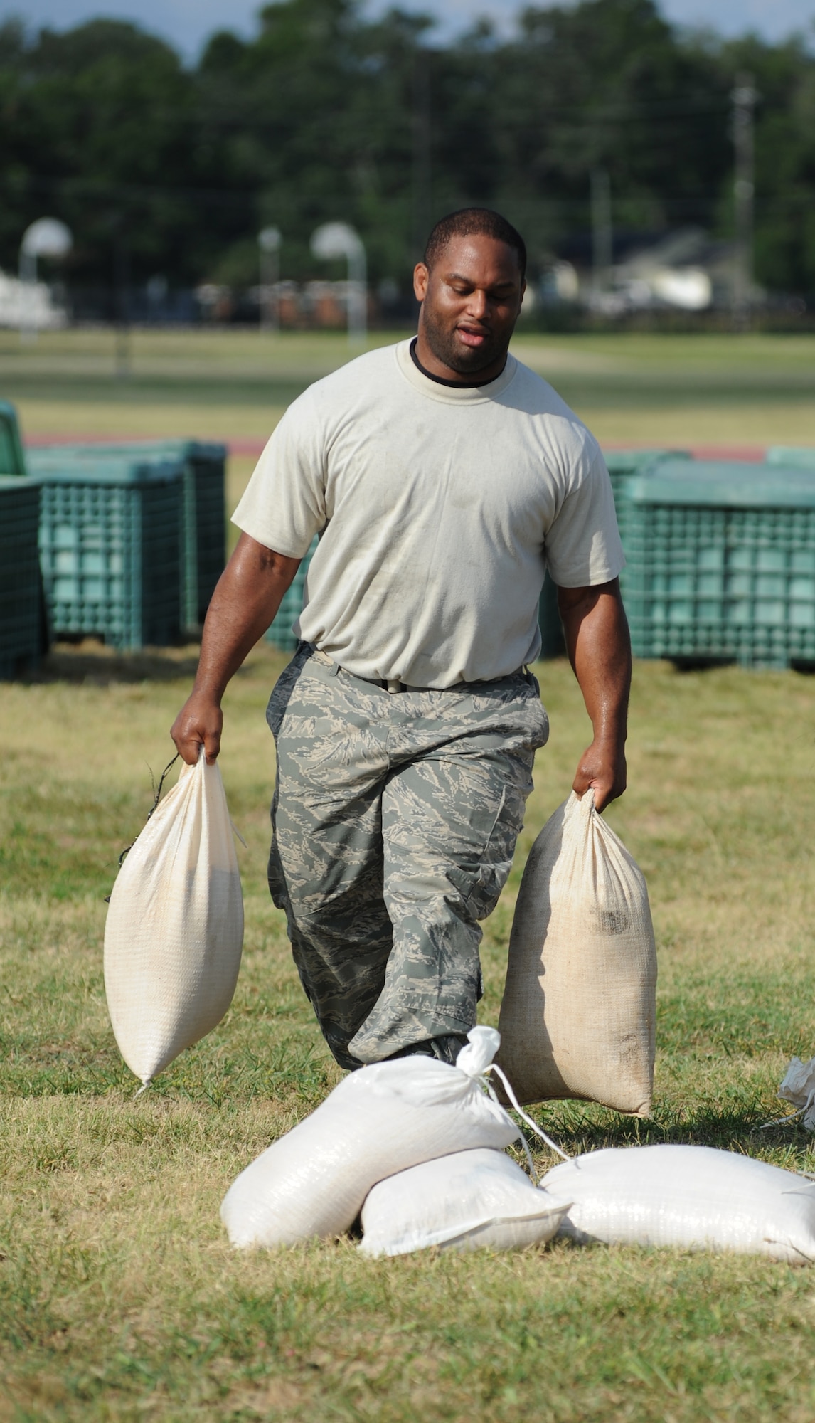 Team Blazer member Staff Sgt. Jonathan Brown, 81st Force Support Squadron, competes in the “Bunker Hill” challenge in which each team must properly build a freestanding sandbag barricade per the Airman’s Manual specifications during the 81st Mission Support Group Ultimate Warrior Challenge June 1, 2012, at the Triangle Track at Keesler Air Force Base, Miss.  The challenge was held in honor of fellow service members who lost their lives in the fight for our nation’s freedom. It consisted of nine four-member teams racing in a competition designed to take them through various aspects of a deployment.  (U.S. Air Force photo by Kemberly Groue)