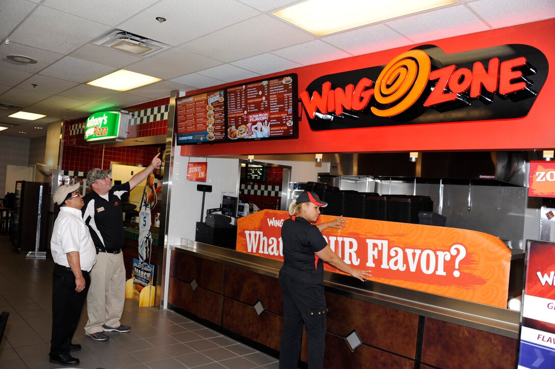 "Wing Zone" employees get set to open menu the new addition to the Mini-Mall food court located in bldg 740 on May 31, 2012 at Sheppard Air Force Base, Texas.    The mini-mall on Sheppard has undergone multiple renovations in recent months to better serve the base populace.  (U.S. Air Force photo/Danny Webb)