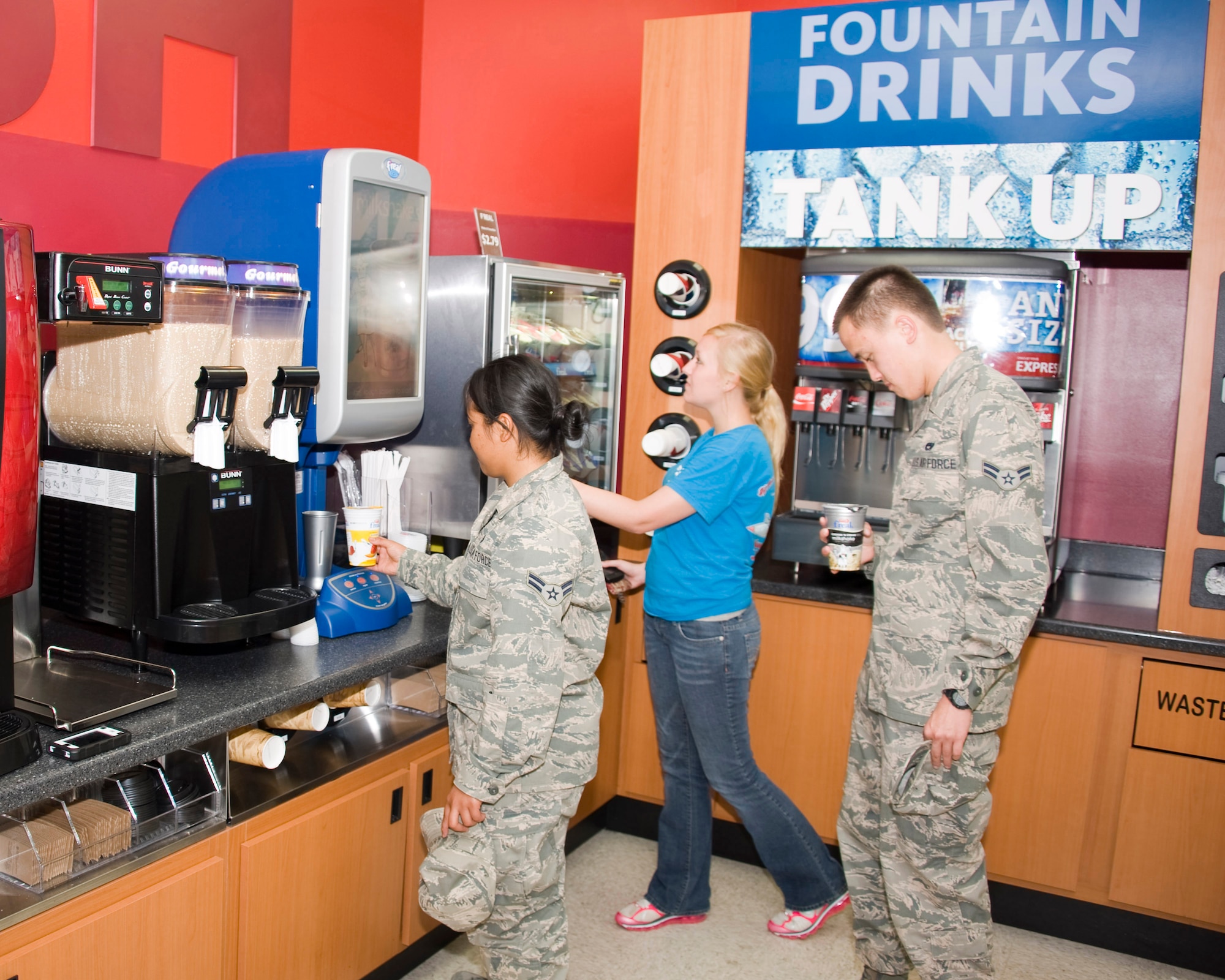 Airmen try out the new milkshake machine at the Sheppard Troop store on May 31, 2012. The mini-mall on Sheppard has undergone multiple renovations in recent months to better serve the base populace.  (U.S. Air Force photo/Danny Webb)