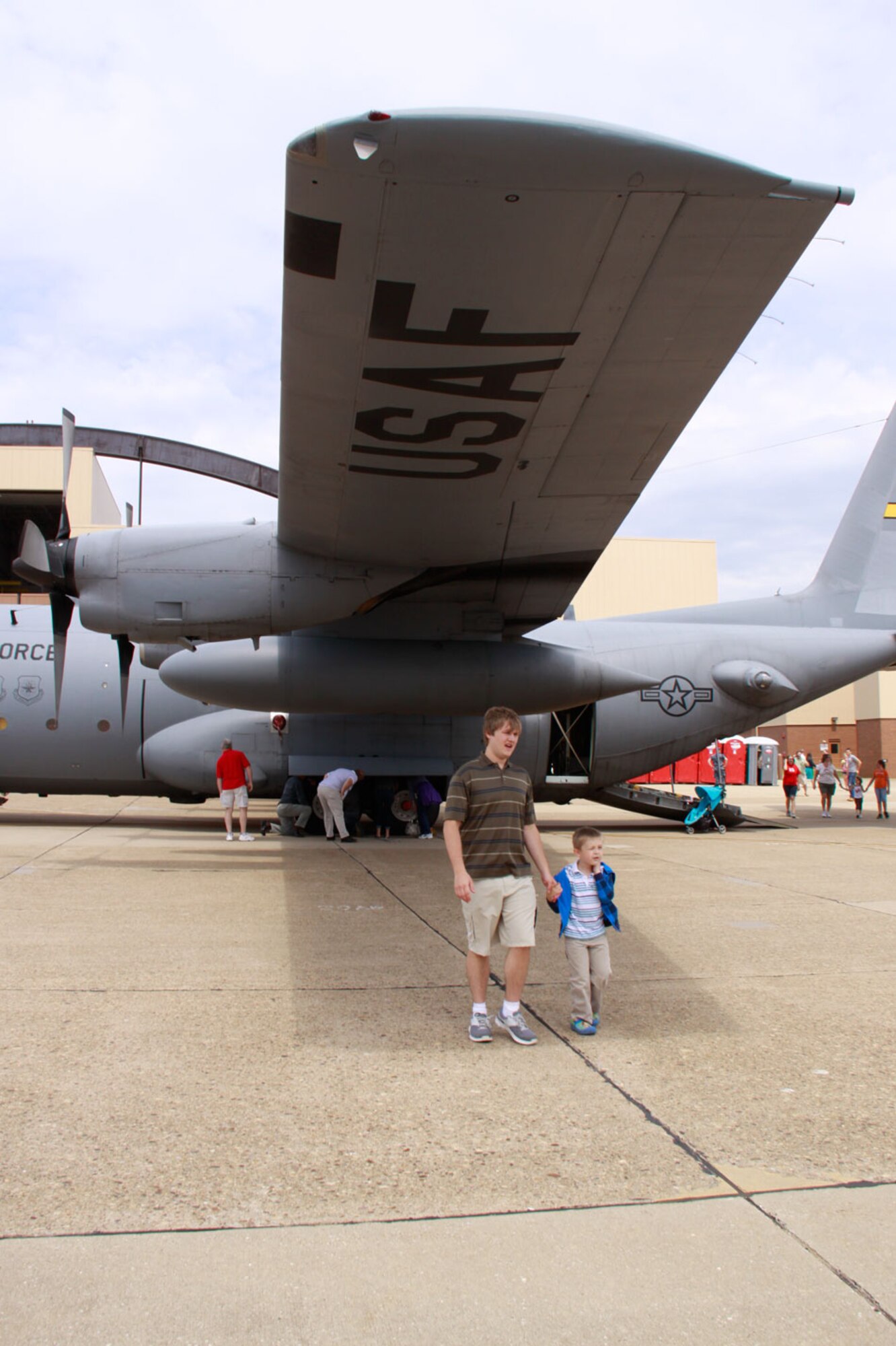 Sean Woleslagle and Jamison McCauley, son and grandson of newly retired Master Sgt. David Woleslagle of the Aeromedical Staging Squadron, enjoy the static C-130 H2 display on the flightline at the 911th Airlift Wing, June 3, 2012. Sean, newly enlisted to the Air Force, showed Jamison around the numerous events at Family Day, such as the C-130 display and the car show, after his father’s retirement ceremony earlier in the day. (U.S. Air Force photo by Airman 1st Class Justyne Obeldobel/Released)