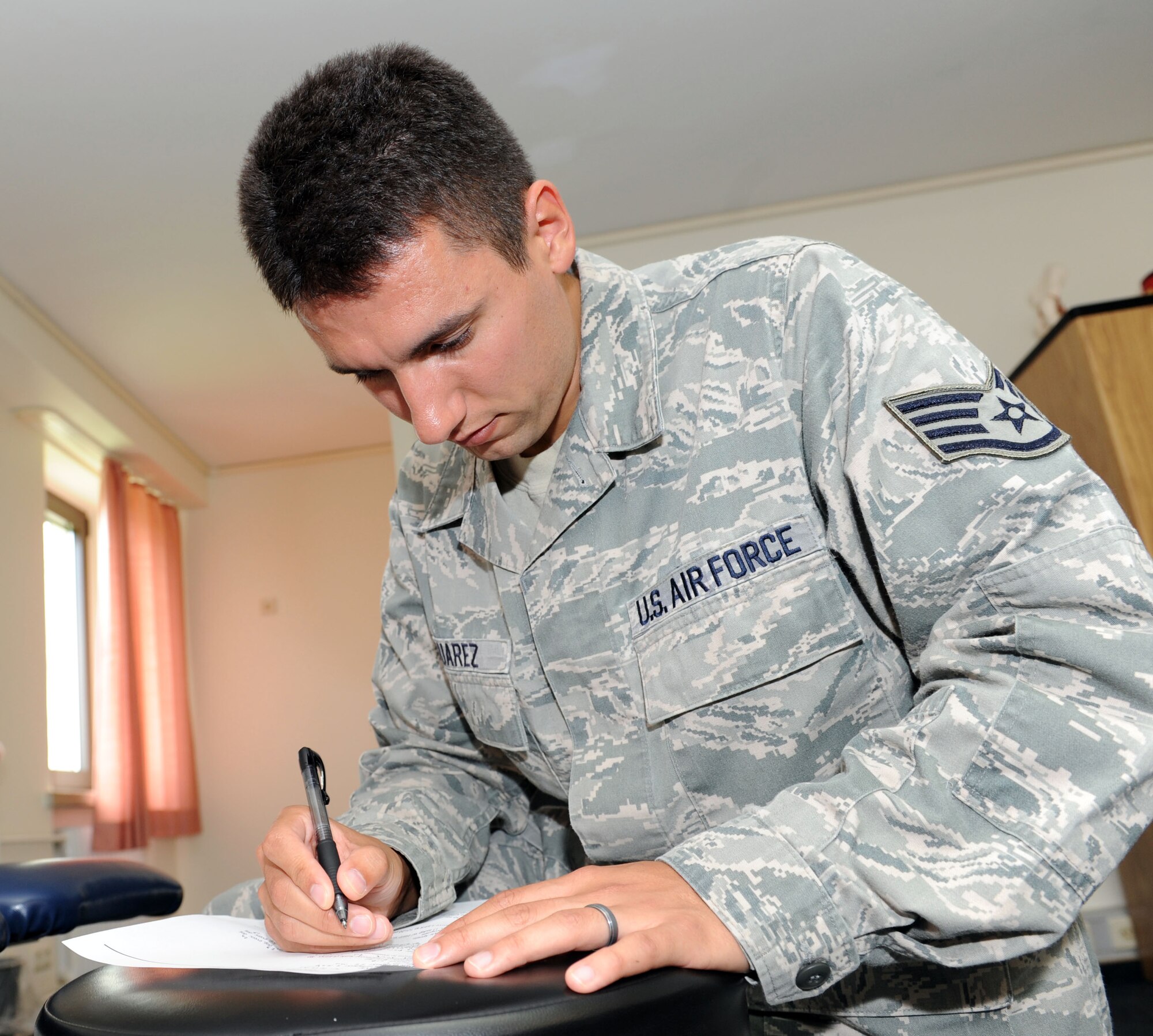 SPANGDAHLEM AIR BASE, Germany – Staff Sgt. Joseph Suarez, 52nd Medical Operations Squadron physical therapy technician, documents a patient’s ankle measurement during an evaluation at the physical therapy clinic here June 5. The clinic provides service to active-duty service members as well as family members and retirees who are recovering from surgery. (U.S. Air Force photo by Senior Airman Christopher Toon/Released)



