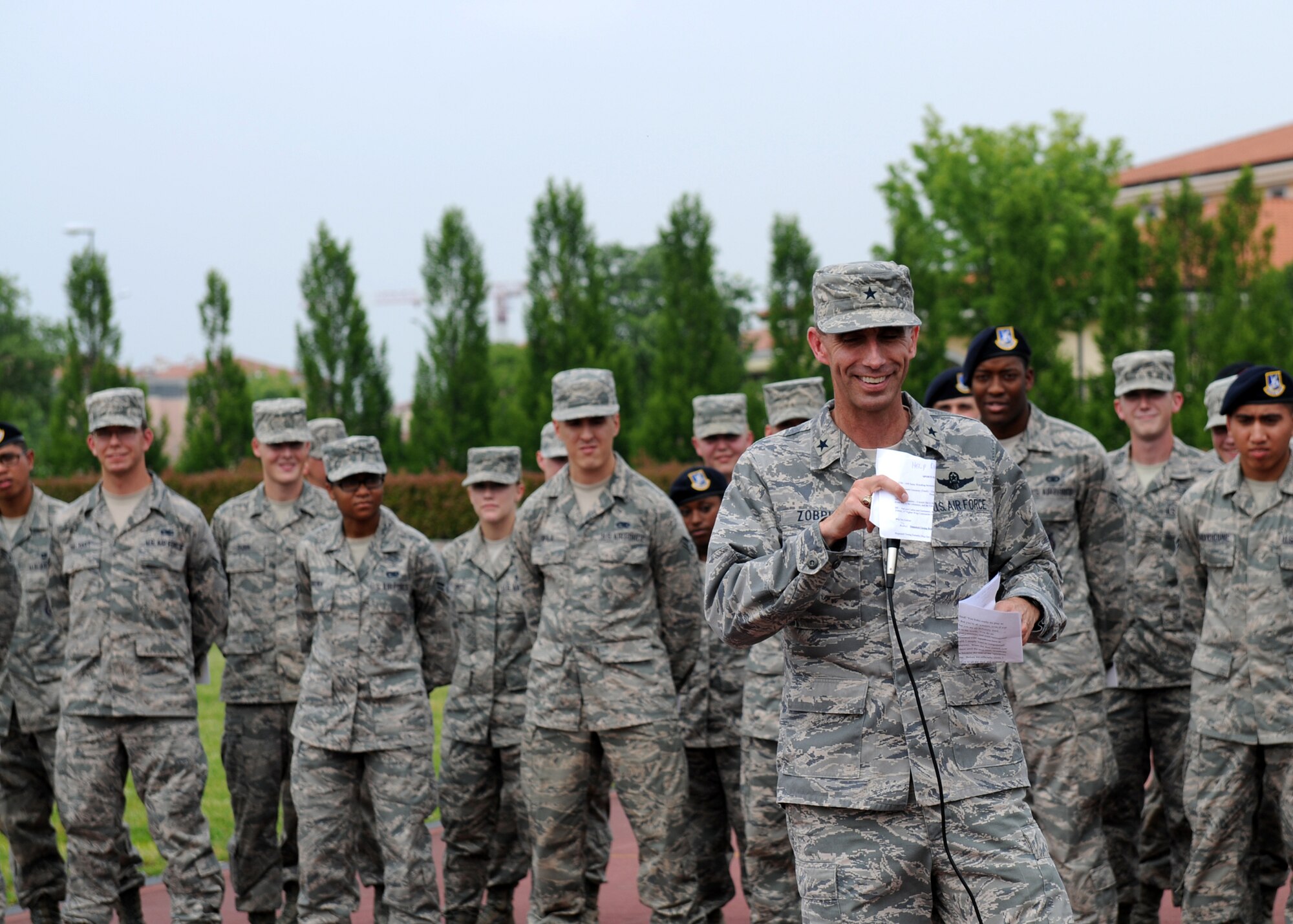 Brig. Gen. Scott Zobrist, 31st Fighter Wing commander, speaks to 31st Fighter Wing sports day tournament participants before presenting awards to the event's top achievers June 1 at the Dragon Fitness Center. More than 950 Team Aviano members proved victorious during the sports day in which the 31st Civil Engineer Squadron emerged as the top overall unit. (U.S. Air Force photo/ Senior Airman Katherine Windish)