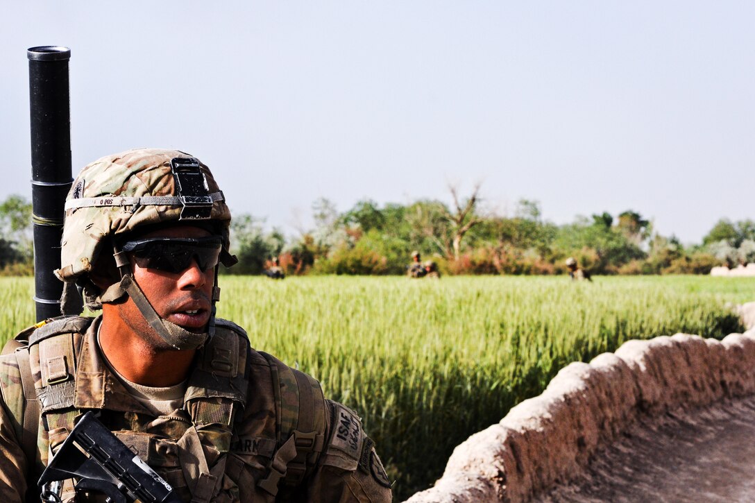 U.S. Army Pfc. Jared Johnson Provides Security During A Patrol Outside ...