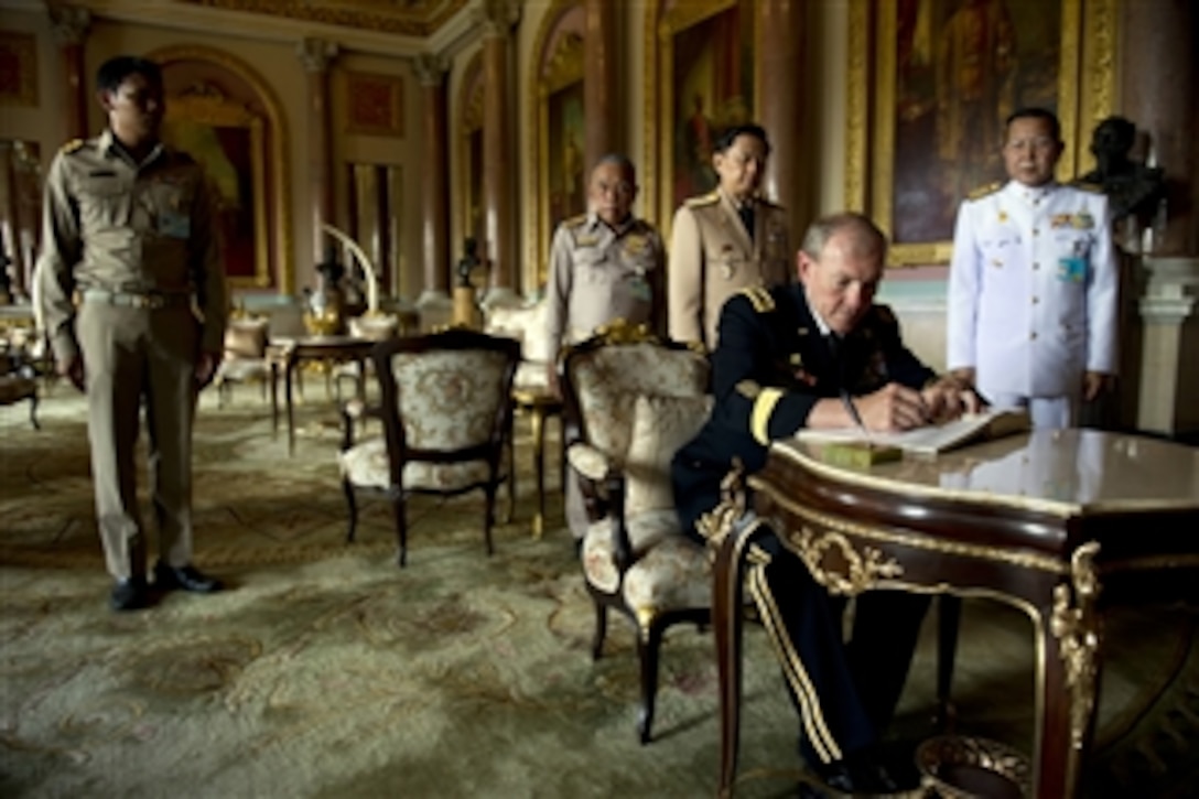 Chairman of the Joint Chiefs of Staff Gen. Martin E. Dempsey signs the guest book at the Grand Palace in Bangkok, Thailand, on June 5, 2012.  