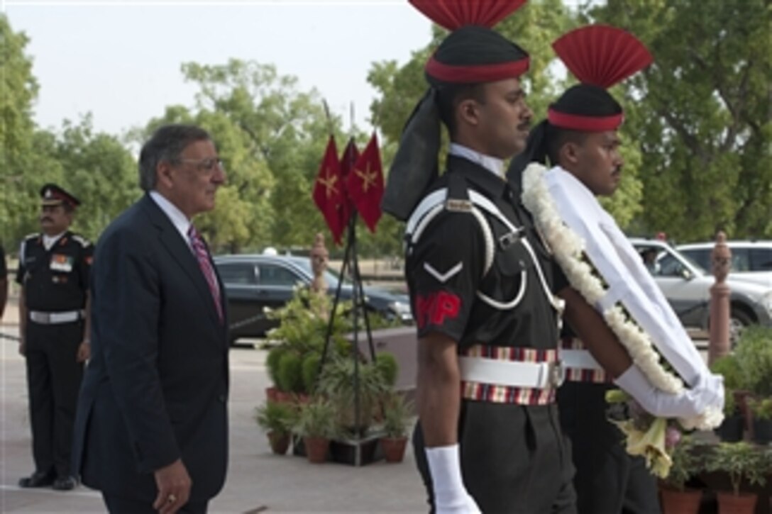 Secretary of Defense Leon E. Panetta walks with Indian military policemen during a wreath laying ceremony at India Gate in Delhi, India, on June 6, 2012.  Panetta laid a wreath in honor of fallen Indian military members while on a two-day visit to Delhi for discussions with Indian defense leadership.  