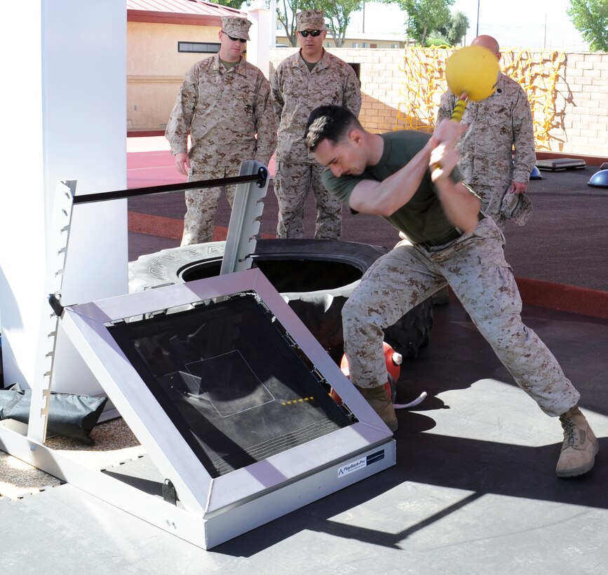 Corporal Austin Swesey, a calibration technician with Fleet Support Division stationed aboard Marine Corps Logistics Base Barstow demonstrates one of the many stations of the new martial arts training facility aboard the installation June 6.