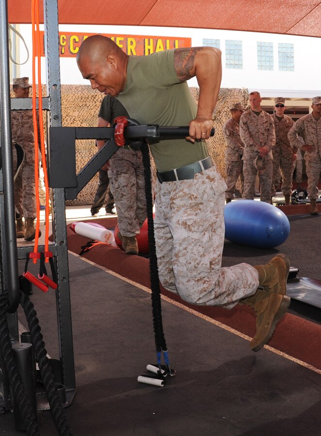 Master Sergeant Barvon Lav, Communications Chief aboard with Marine Corps Logistics Base Barstow, demonstrates one of the many stations of the new martial arts training facility aboard the installation June 6.
