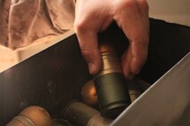 Sgt. Waylon Sliker counts 40-millimeter high-explosive dual-purpose grenade rounds at the 1st Battalion, 8th Marine Regiment ammunition supply point, May 15, 2012. Sliker is the sole ammo technician for 1st Bn., 8th Marines.