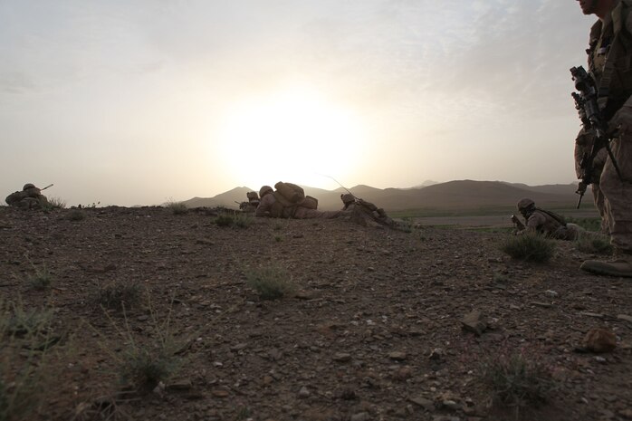 Marines with Charlie Company, 1st Battalion, 8th Marine Regiment, prepare to search a village for Taliban fighters in the early morning, April 18, 2012. The Marines and sailors with Charlie Company took part in a month long operation where they cleared the Gostan valley of enemy forces.