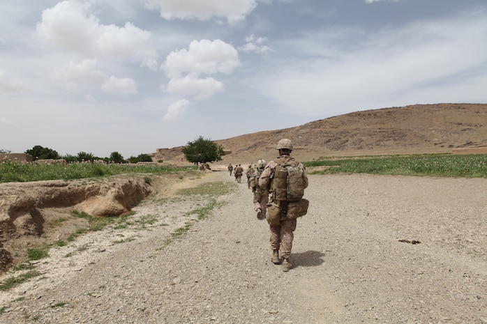 Marines with Charlie Company, 1st Battalion, 8th Marine Regiment, patrol through rough Afghan terrain while searching for enemy combatants, April 17, 2012. The Marines and sailors with Charlie Company took part in a month long operation where they cleared the Gostan valley of enemy forces.