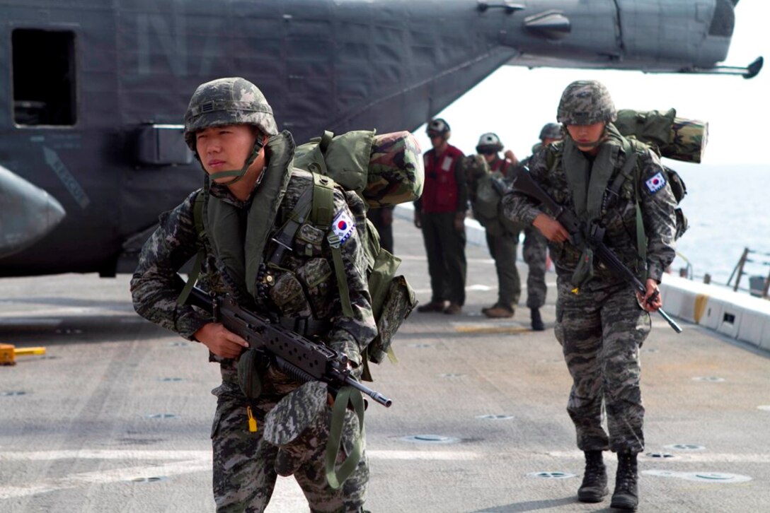 Grenadier Kwon Woo Kim, a Republic of Korea Marine, arrives aboard USS New Orleans here June 1 during flight operations with the ship and the 11th Marine Expeditionary Unit. Marines from the Republic of Korea arrived on the ship to sail to Hawaii for the Korean Marine Exercise Program 12-9, a regularly scheduled combined exercise involving a platoon of Republic of Korea Marines from 1st Company, 21st Battalion, 1st Marine Division, and USMC forces from 1st Battalion, 3rd Marines.  This exercise will focus on strengthening the ROK-U.S. relationship while enhancing tactical interoperability and developing ROK Marine operational capabilities.