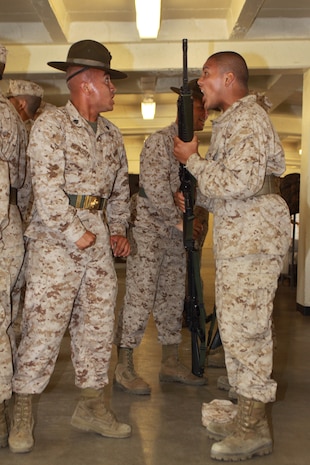 Company K drill instructors inspect their recruits weapons June 1 during Senior Drill Instructor Inspection aboard Marine Corps Recruit Depot San Diego. Recruits were also inspected on their uniforms and Marine Corps knowledge. This inspection gave the senior drill instructors a chance to see which recruits required extra attention.