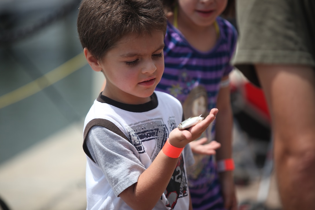 Many children were able to catch vast amounts of small fish at the waterfront at Morehead City, N.C. during Military Appreciation Day, June 2. Some people went on a boat to fish, while others fished off the docks. 