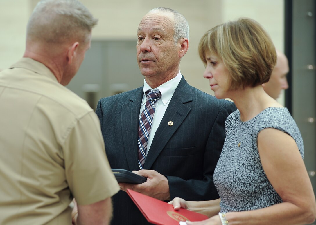 The family of the late Sgt. William J. Woitowicz is presented their son's Silver Star for his heroism in combat on June 7, 2011, at the Marine Corps Museum in Triangle, Va., April 28, 2012. 