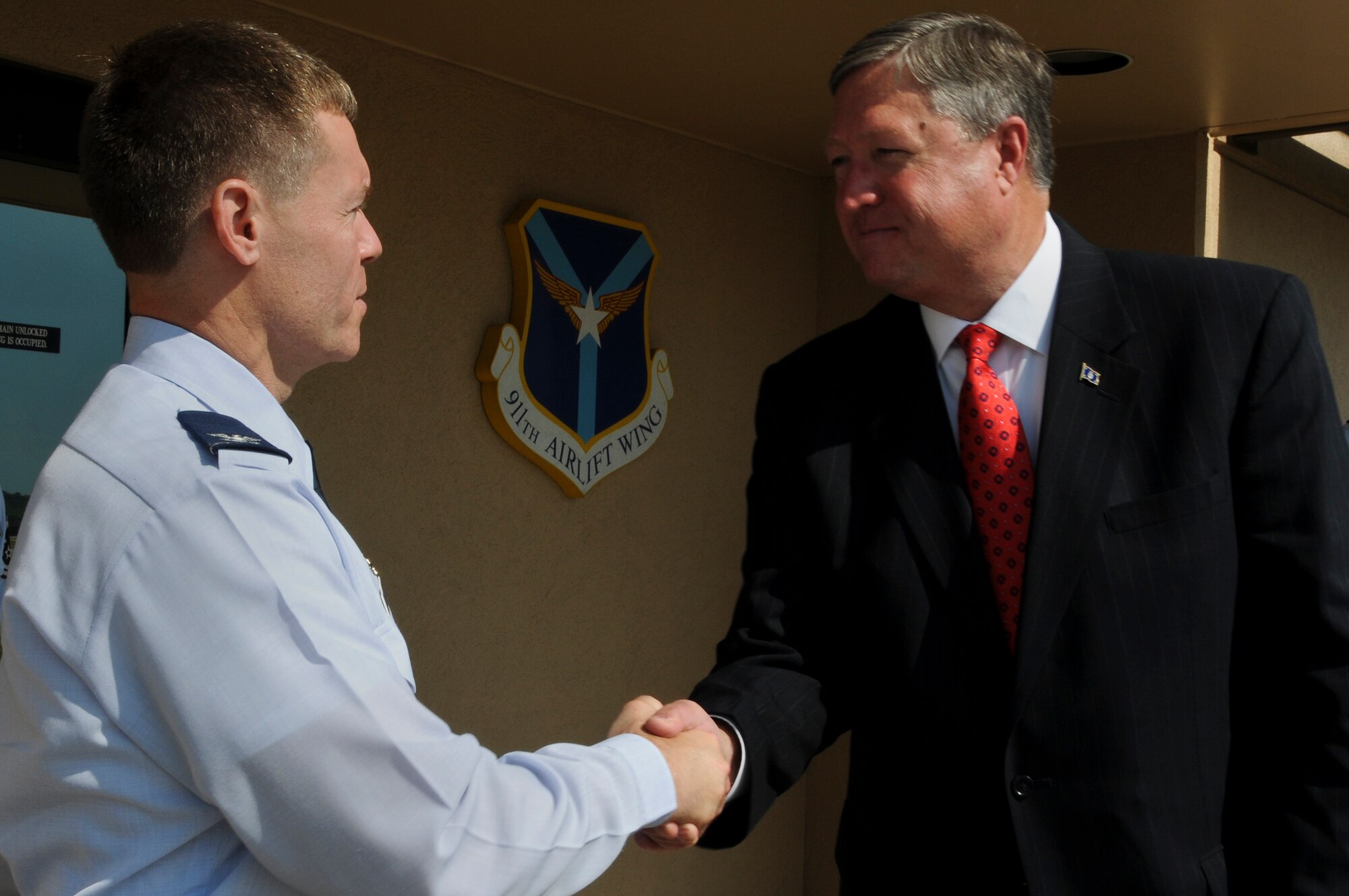 Secretary of the Air Force Michael Donley thanks Col. Craig C. Peters, 911th Airlift Wing commander, for his warm welcome and hospitality during his visit to the 911th Airlift Wing in Pittsburgh, Pa., June 7, 2012.  During the visit, Donley also took the opportunity to personally thank unit members for their contributions to national security and for providing additional insight into the 911th AW's mission.  (U.S. Air Force photo/Senior Airman Joshua J. Seybert)