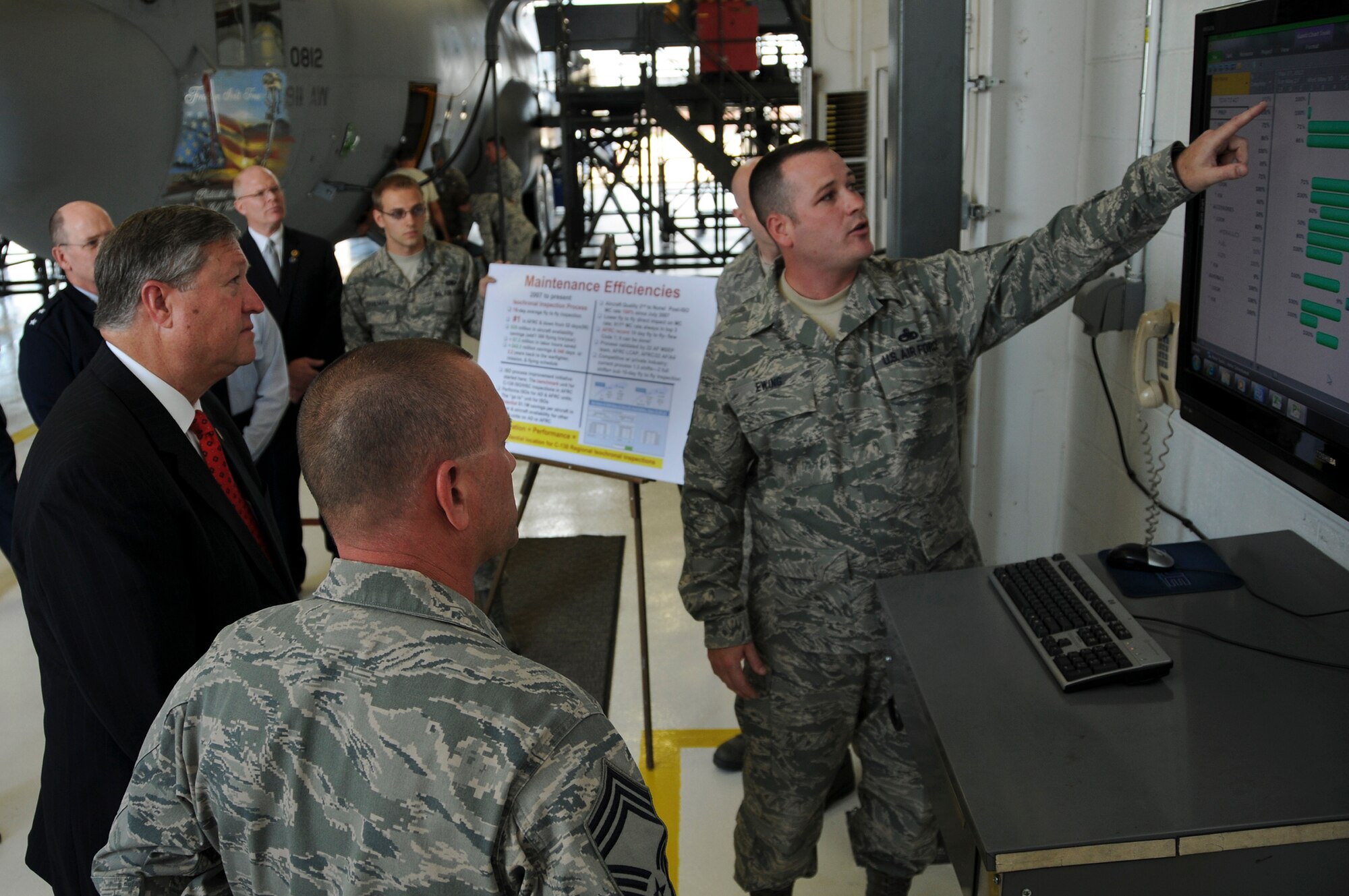 Secretary of the Air Force Michael Donley is briefed on the 911th Airlift Wing's C-130 Hercules aircraft isochronal inspection process by Master Sgt. Sam Ewing, 911th Maintenance Squadron flight chief, during his visit to the 911th AW in Pittsburgh, Pa., June 7, 2012. During the visit, the Secretary met with Airmen, base officials and local civic leaders to discuss current defense budget requirements and the Air Force's force structure recommendations submitted to Congress as part of the Fiscal Year 2013 President's Budget. (U.S. Air Force photo/Senior Airman Joshua J. Seybert)