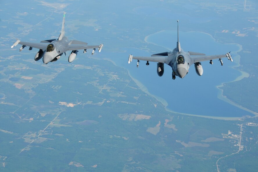 F16CM Fighting Falcons from the 180th Fighter Wing, Ohio Air National Guard soar through the skies of Mich. during an Employer Support of the Guard and Reserve Bosslift June 7, 2012.  The 180th FW and the 121st Air Refueling Wing also of the Ohio Air National Guard teamed up to Support the Northwest Ohio ESGR organization to give civilian employers of service members a chance to see what their employees do when performing their military duties. ESGR facilitates and promotes a cooperative culture of employer support for National Guard and Reserve Service by developing and advocating mutually beneficial initiatives between employers and their Service members and acting as the employer’s principal advocate within the Department of Defense. (U.S. Air Force photo by Senior Airman Amber Williams/Released)