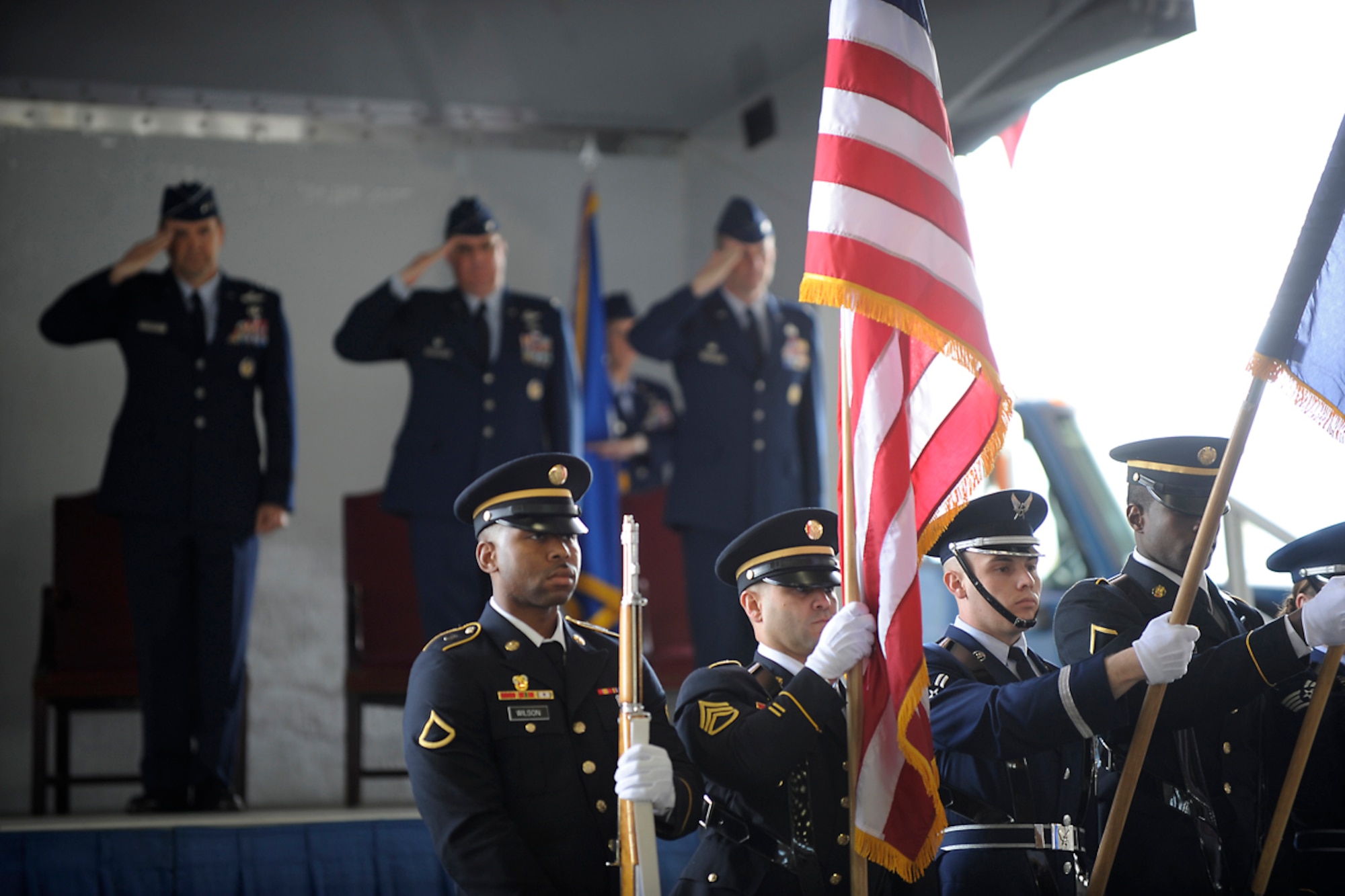 JOINT BASE ELMENDORF-RICHARDSON, Alaska -- Members of the official party salute during the playing of the national anthem during the 673d Air Base Wing change of command ceremony June 1. Air Force Col. Brian Duffy takes command as Air Force Col. Robert Evans retires after 25 years of service. (U.S. Air Force photo by Staff Sgt. Cynthia Spalding)