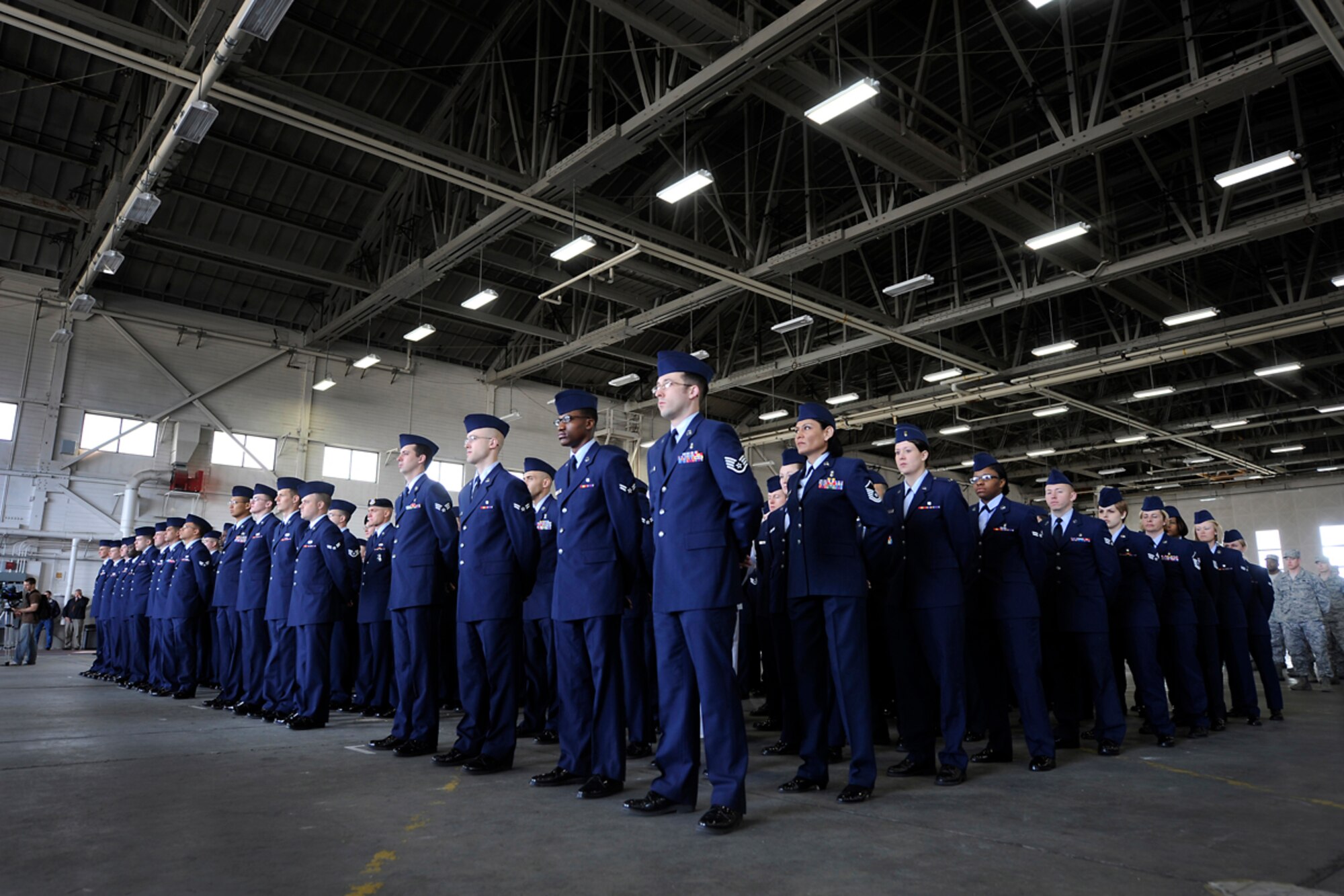 JOINT BASE ELMENDORF-RICHARDSON, Alaska -- A squadron formation of Airmen, Soldiers and Sailors stands at parade rest during the 673d Air Base Wing change of command ceremony June 1. Air Force Col. Brian Duffy takes command as Air Force Col. Robert Evans retires after 25 years of service. (U.S. Air Force photo by Staff Sgt. Cynthia Spalding)