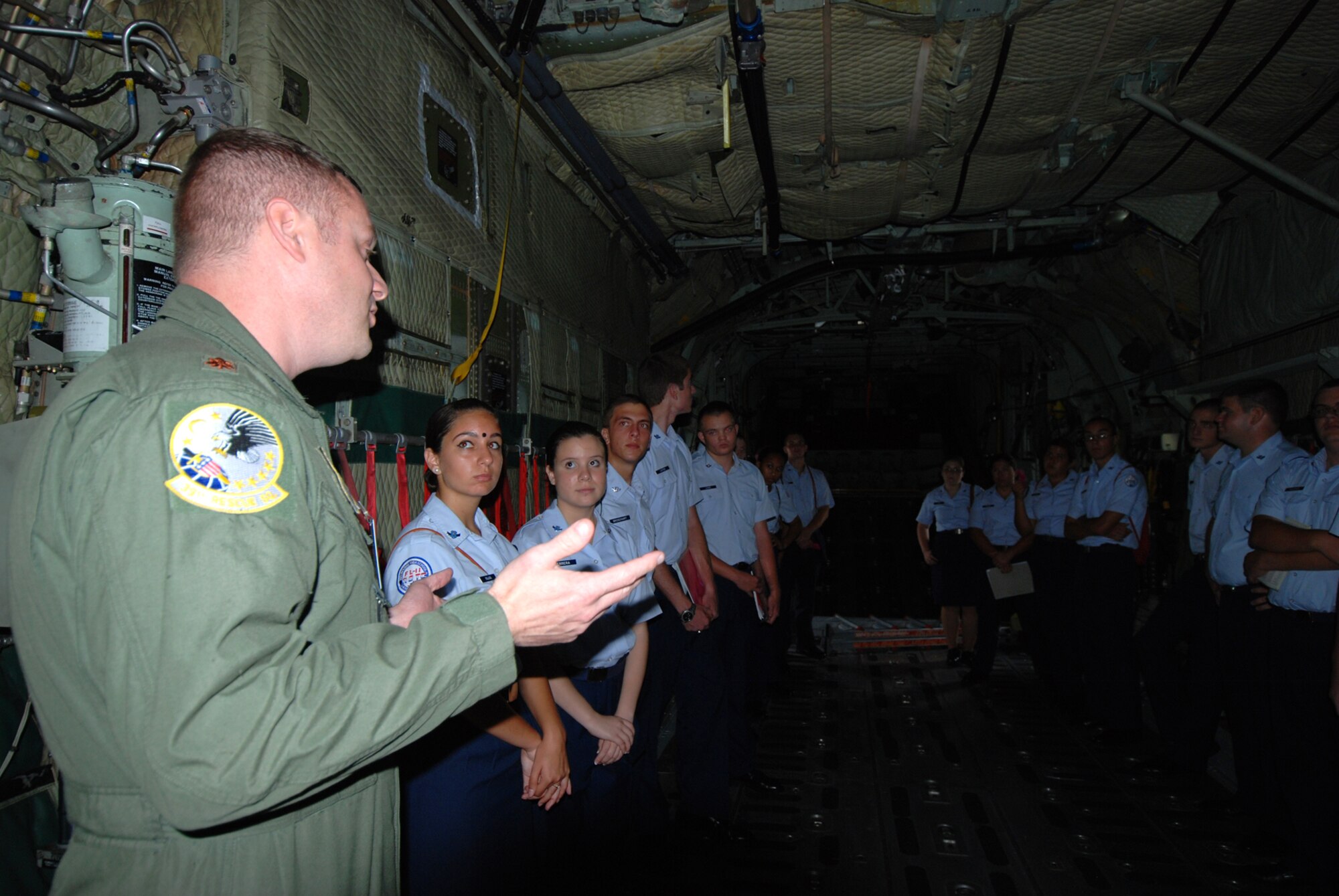Maj. Nick Philpitt, HC-130P/N King navigator, 920th Rescue Wing, Patrick Air Force Base, shows local Air Force Junior Reserve Officer Corps cadets inside a King aircraft They were among eighty cadets, of the best of the best, out of different Junior ROTC units from four local Brevard County High Schools. They spent a week at Patrick Air Force Base, Fla. learning about the Air Force. They also met with Col. Rob Ament, the 920th RQW vice wing commander, who gave them an in-depth briefing on combat search and rescue. (U.S. Air Force photo/Capt. Cathleen Snow)