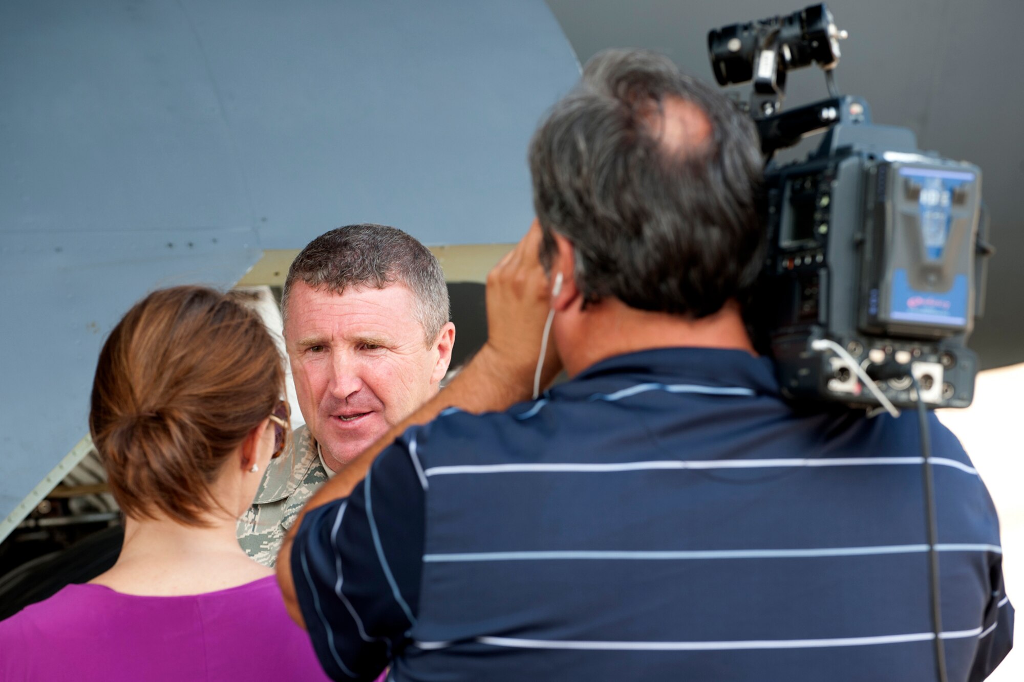 U.S. Air Force Master Sgt. David Smith, 307th Aircraft Maintenance Squadron crew chief, is interviewed by Leslie Draffin, KTAL News 6 morning anchor, for a news segment, Barksdale Air Force Base, La., June 6, 2012. The Barksdale Profile segment focused how airmen battle against the summer heat on the Barksdale flight line. (U.S. Air Force photo by Master Sgt. Greg Steele/Released)