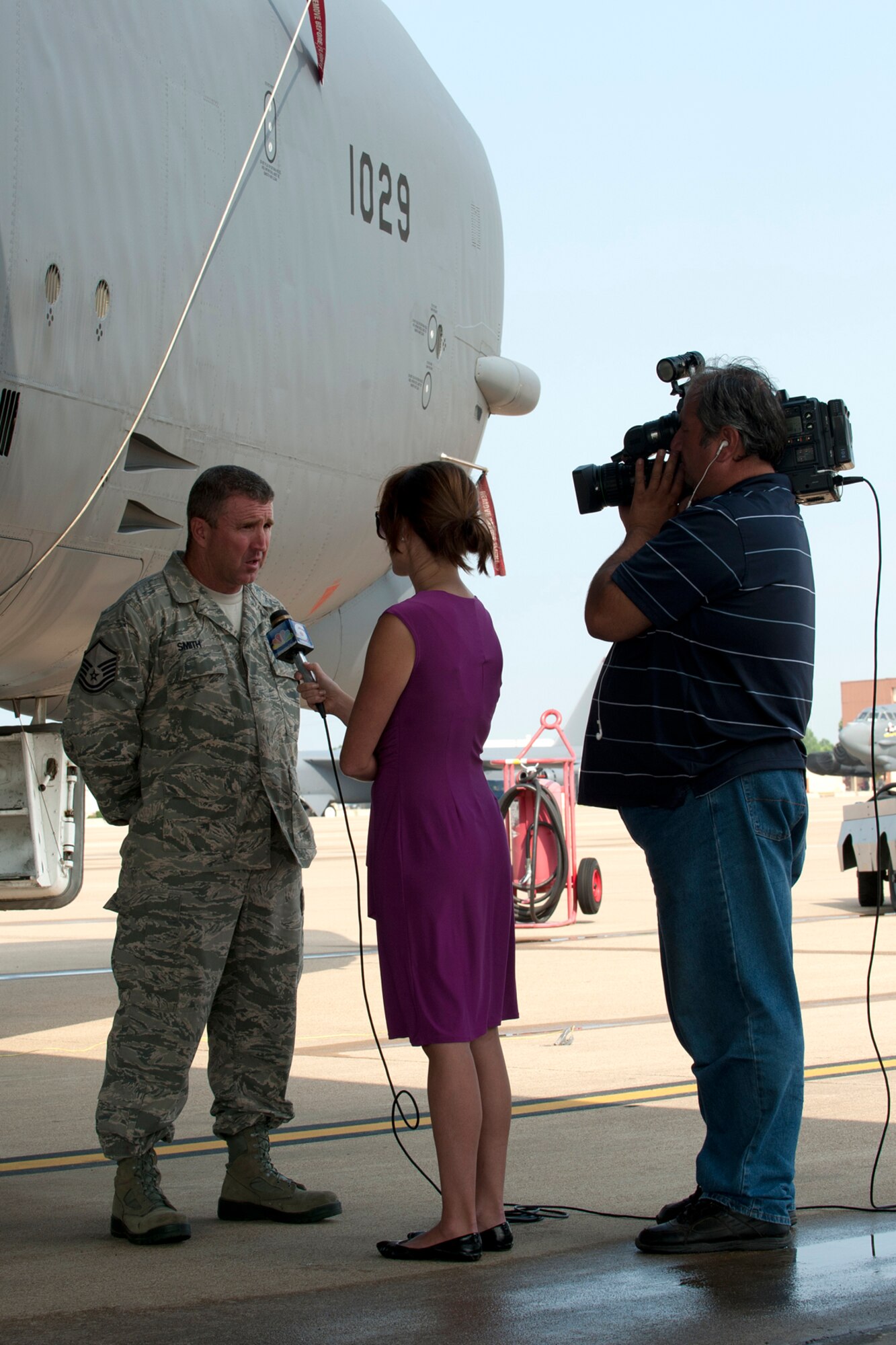 U.S. Air Force Master Sgt. David Smith, 307th Aircraft Maintenance Squadron crew chief, is interviewed by Leslie Draffin, KTAL News 6 morning anchor, on Barksdale Air Force Base, La., June 6, 2012. Draffin has a weekly segment called the Barksdale Profile, which focuses on personnel and events happening on base. (U.S. Air Force photo by Master Sgt. Greg Steele/Released)